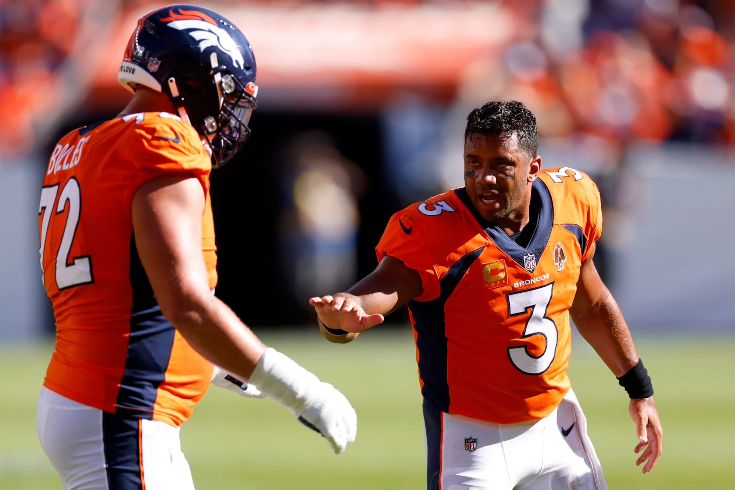 DENVER, COLORADO - SEPTEMBER 18: Russell Wilson #3 of the Denver Broncos congratulates Garett Bolles #72 of the Denver Broncos after a successful field goal in the second quarter of the game against the Houston Texans at Empower Field At Mile High on September 18, 2022 in Denver, Colorado. (Photo by Justin Edmonds/Getty Images)