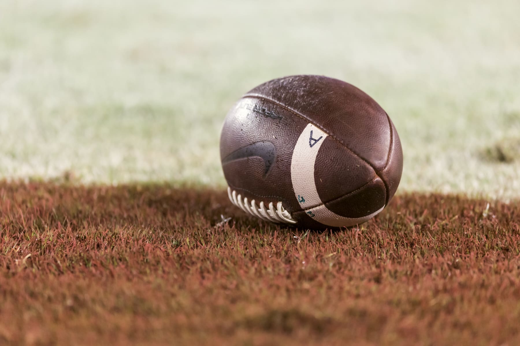 PALO ALTO, CA - OCTOBER 8:  A football rest on the grass at Stanford Stadium before an NCAA football game between the Oregon State Beavers and the Stanford Cardinal on October 8, 2022 in Palo Alto, California.  (Photo by David Madison/Getty Images)