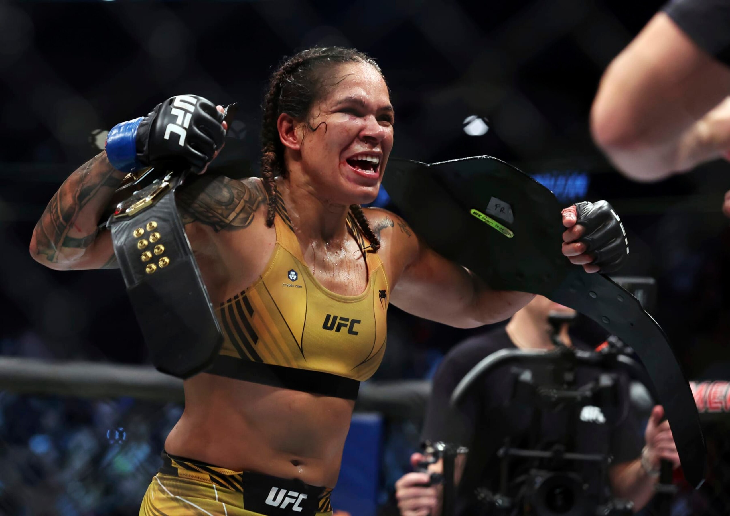 Amanda Nunes reacts after defeating Julianna Pena in a mixed martial arts women's bantamweight title bout at UFC 277 on Saturday, July 30, 2022, in Dallas. (AP Photo/Richard W. Rodriguez)