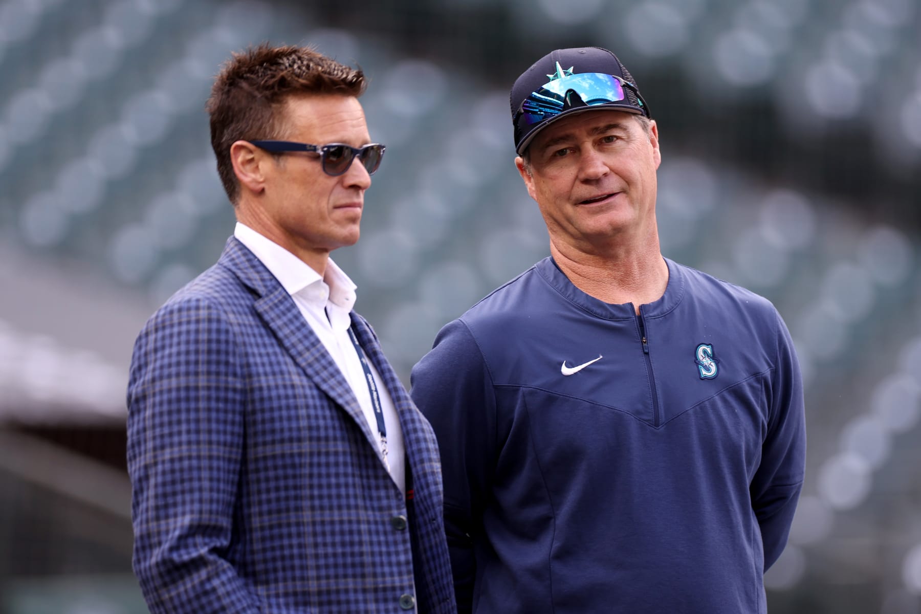 SEATTLE, WASHINGTON - MARCH 30: General Manager Jerry Dipoto speaks with manager Scott Servais #9 of the Seattle Mariners during Opening Day at T-Mobile Park on March 30, 2023 in Seattle, Washington. (Photo by Steph Chambers/Getty Images)