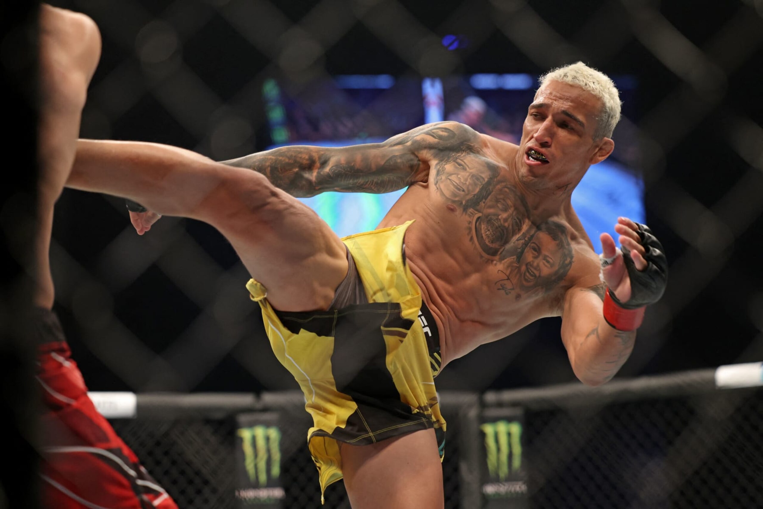 Charles Oliveira competes against Islam Makhachev in the lightweight championship at the Ultimate Fighting Championship (UFC) event at the Etihad Arena in Abu Dhabi on October 22, 2022. (Photo by Giuseppe CACACE / AFP) (Photo by GIUSEPPE CACACE/AFP via Getty Images)