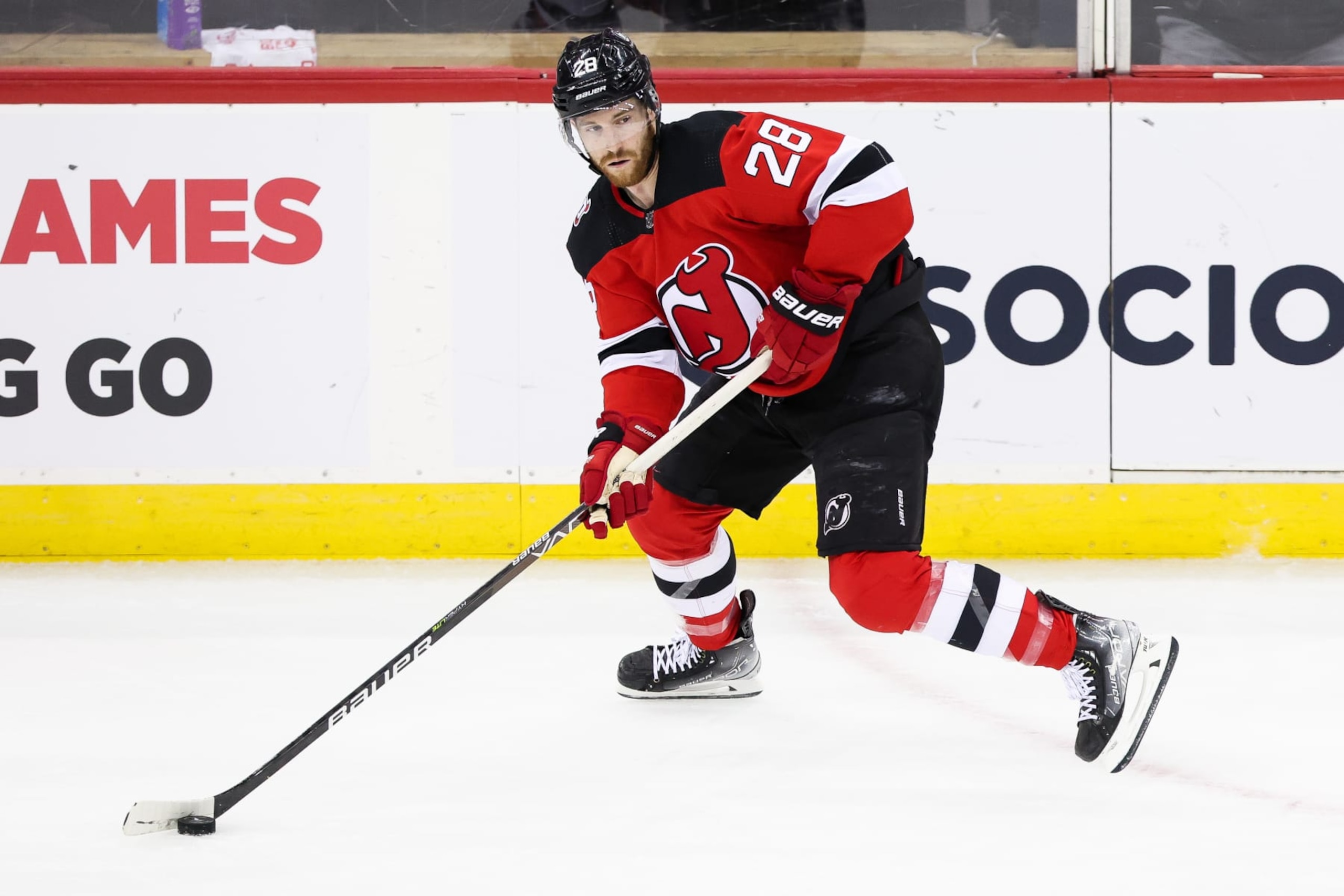 NEWARK, NJ - MAY 09: New Jersey Devils defenseman Damon Severson (28) skates with the puck during Game 4 of an Eastern Conference Second Round playoff game between the Carolina Hurricanes and the New Jersey Devils on May 9, 2023, at Prudential Center in Newark, New Jersey. (Photo by Andrew Mordzynski/Icon Sportswire via Getty Images)