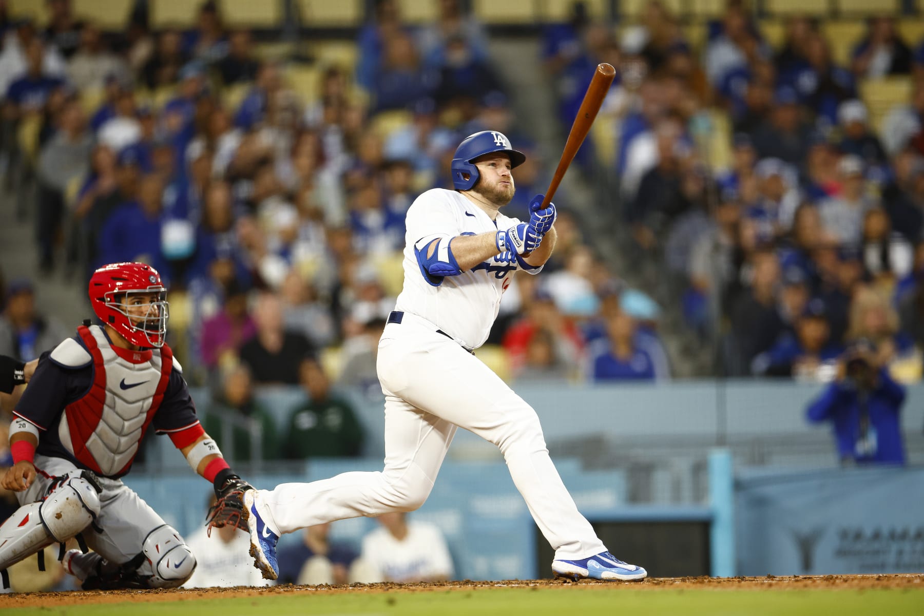 LOS ANGELES, CALIFORNIA - MAY 30:  Max Muncy #13 of the Los Angeles Dodgers hits a ground rule double against the Washington Nationals in the third inning at Dodger Stadium on May 30, 2023 in Los Angeles, California. (Photo by Ronald Martinez/Getty Images)