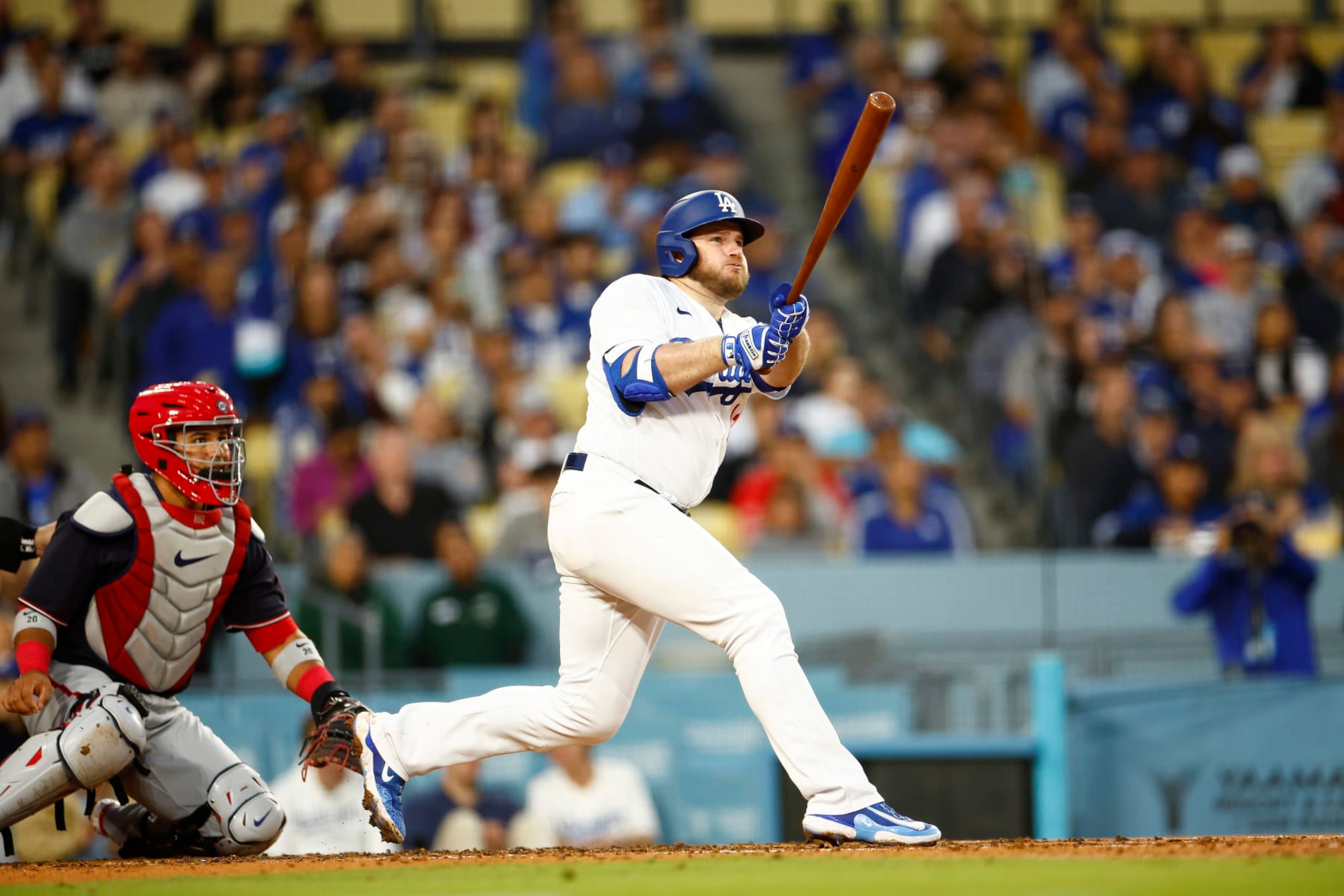 LOS ANGELES, CALIFORNIA - MAY 30:  Max Muncy #13 of the Los Angeles Dodgers hits a ground rule double against the Washington Nationals in the third inning at Dodger Stadium on May 30, 2023 in Los Angeles, California. (Photo by Ronald Martinez/Getty Images)