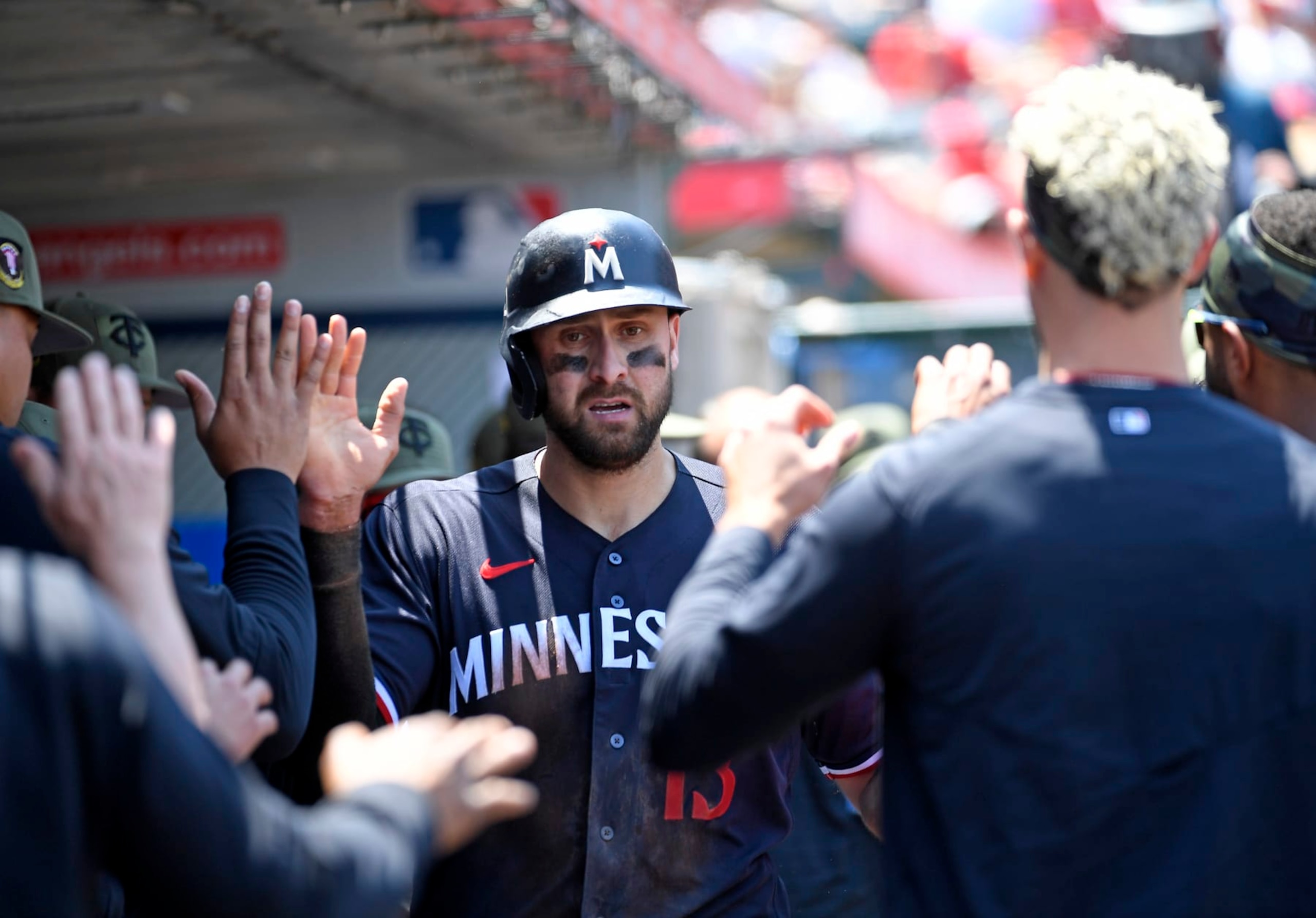 ANAHEIM, CALIFORNIA- MAY 21: Joey Gallo #13 of the Minnesota Twins is congratulated in the dugout after scoring a run against starting pitcher Shohei Ohtani #17 of the Los Angeles Angels during the third inning at Angel Stadium of Anaheim on May 21, 2023 in Anaheim, California. (Photo by Kevork Djansezian/Getty Images)
