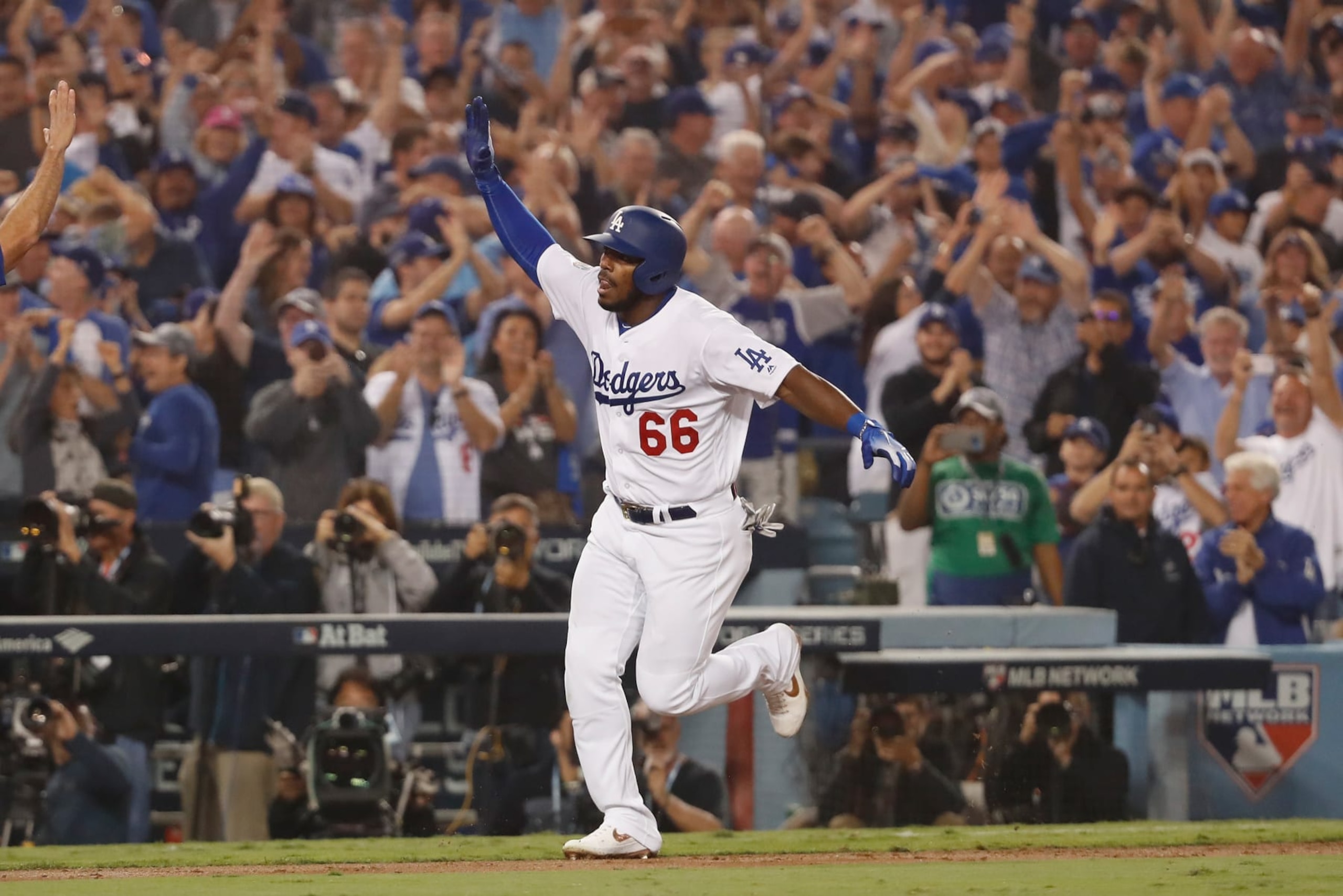 LOS ANGELES, CA - OCTOBER 27:  Yasiel Puig #66 of the Los Angeles Dodgers celebrates on his way to home plate after hitting a three-run home run to left field in the sixth inning of Game Four of the 2018 World Series against pitcher Eduardo Rodriguez #57 of the Boston Red Sox (not in photo) at Dodger Stadium on October 27, 2018 in Los Angeles, California.  (Photo by Sean M. Haffey/Getty Images)