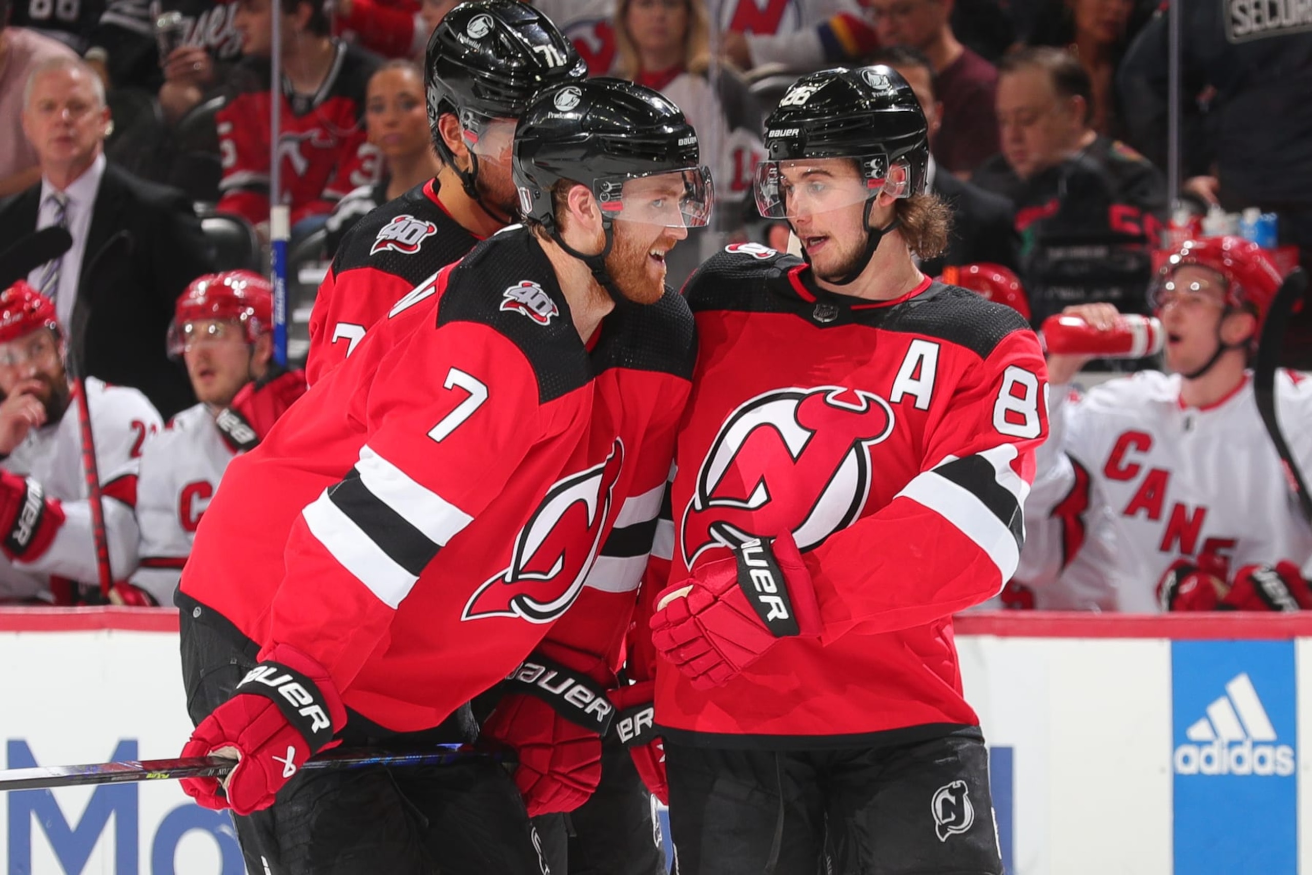 NEWARK, NJ - MAY 07:  Jack Hughes #86 of the New Jersey Devils and Dougie Hamilton #7 of the New Jersey Devils during Game Three of the Second Round of the 2023 Stanley Cup Playoffs against the Carolina Hurricanes at the Prudential Center on May 7, 2023 in Newark, New Jersey.  (Photo by Rich Graessle/NHLI via Getty Images)