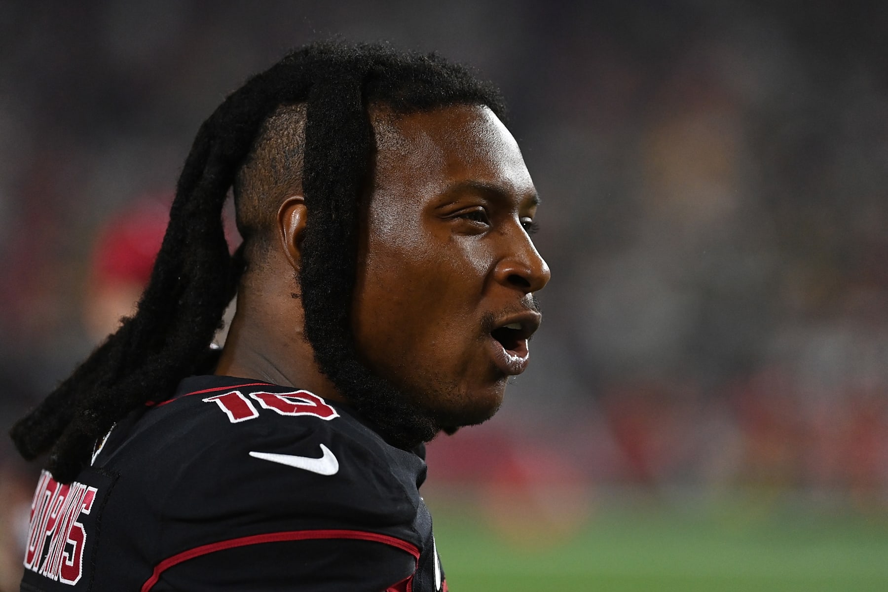 GLENDALE, ARIZONA - OCTOBER 28: DeAndre Hopkins #10 of the Arizona Cardinals watches action from the sideline during the first half against the Green Bay Packers at State Farm Stadium on October 28, 2021 in Glendale, Arizona. (Photo by Norm Hall/Getty Images)
