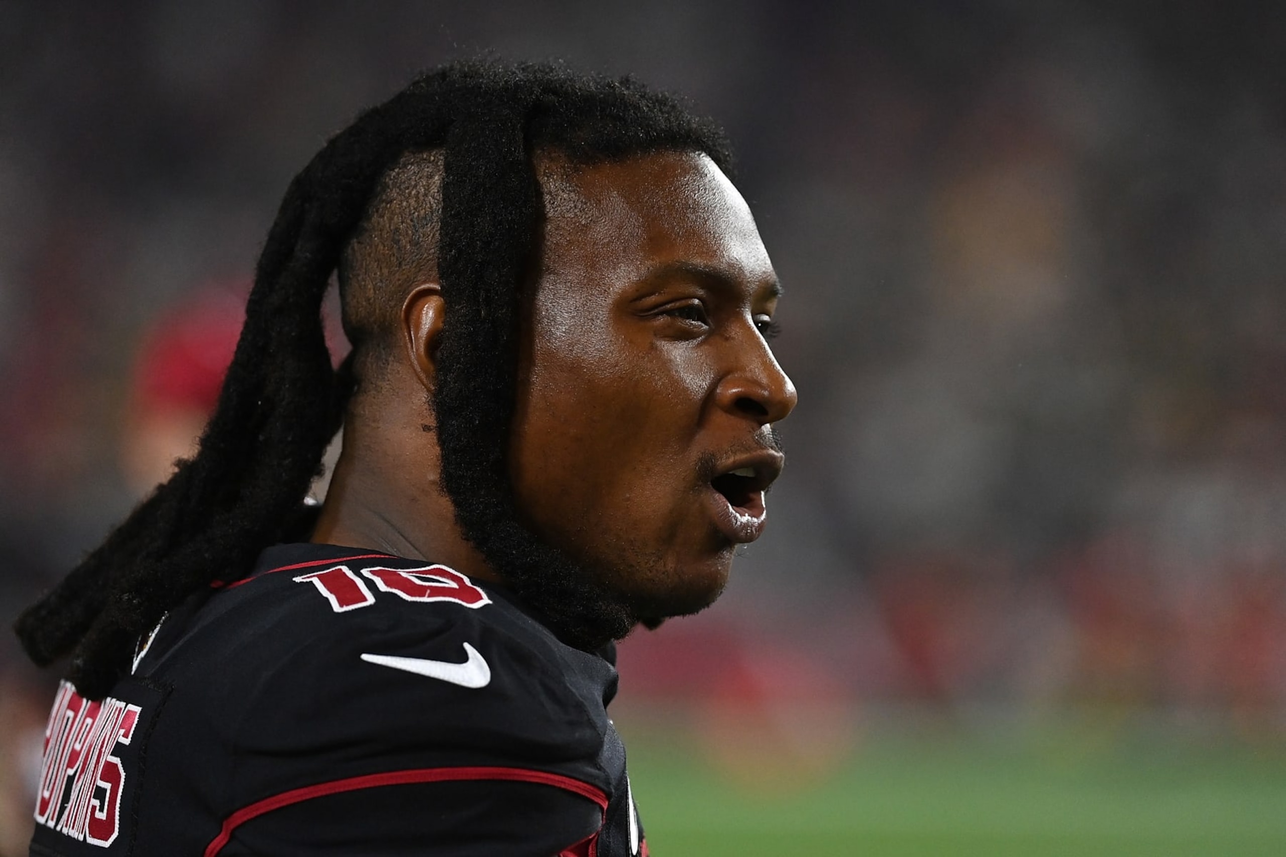 GLENDALE, ARIZONA - OCTOBER 28: DeAndre Hopkins #10 of the Arizona Cardinals watches action from the sideline during the first half against the Green Bay Packers at State Farm Stadium on October 28, 2021 in Glendale, Arizona. (Photo by Norm Hall/Getty Images)