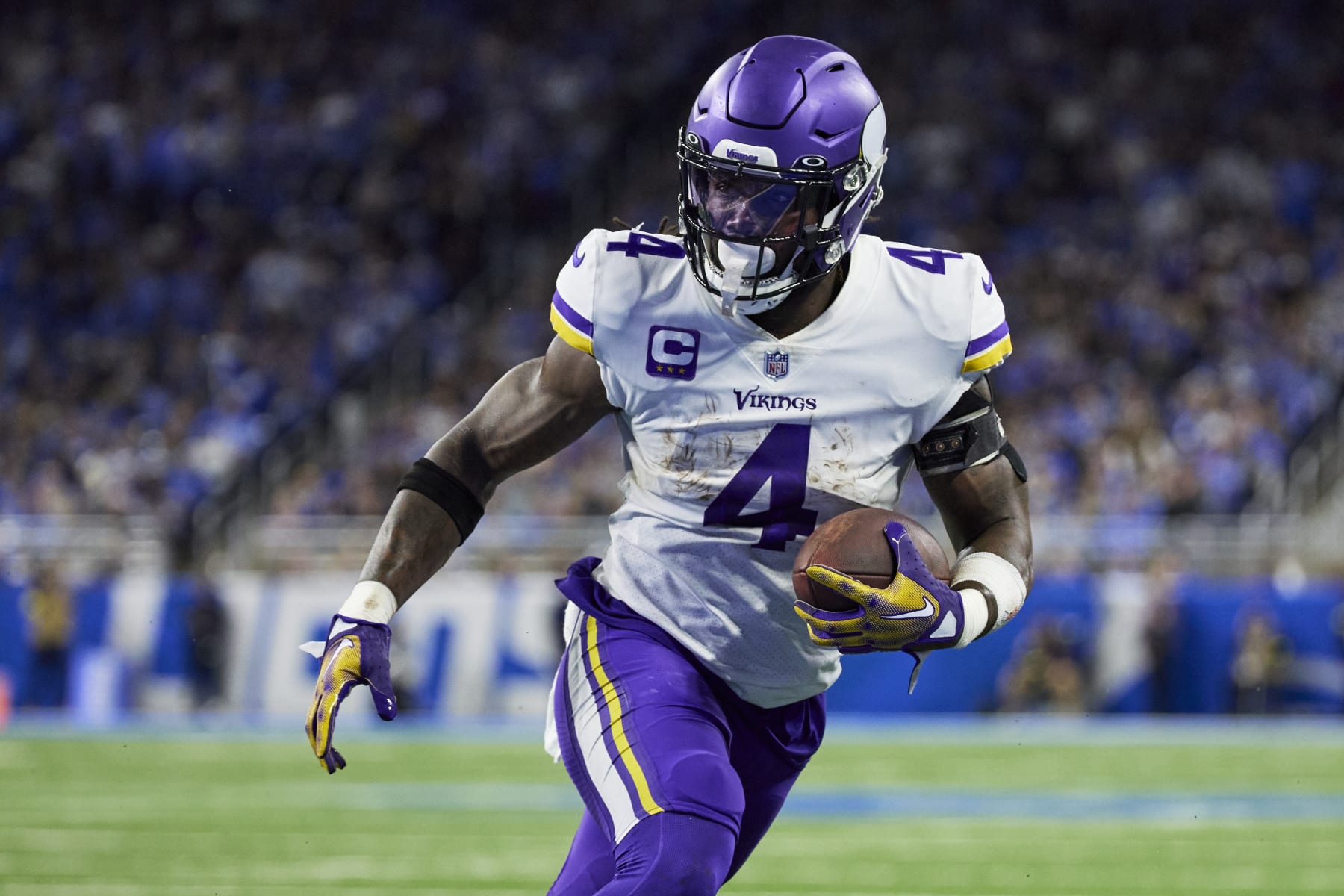 Minnesota Vikings running back Dalvin Cook (4) rushes against the Detroit Lions during an NFL football game, Sunday, Dec. 11, 2022, in Detroit. (AP Photo/Rick Osentoski)