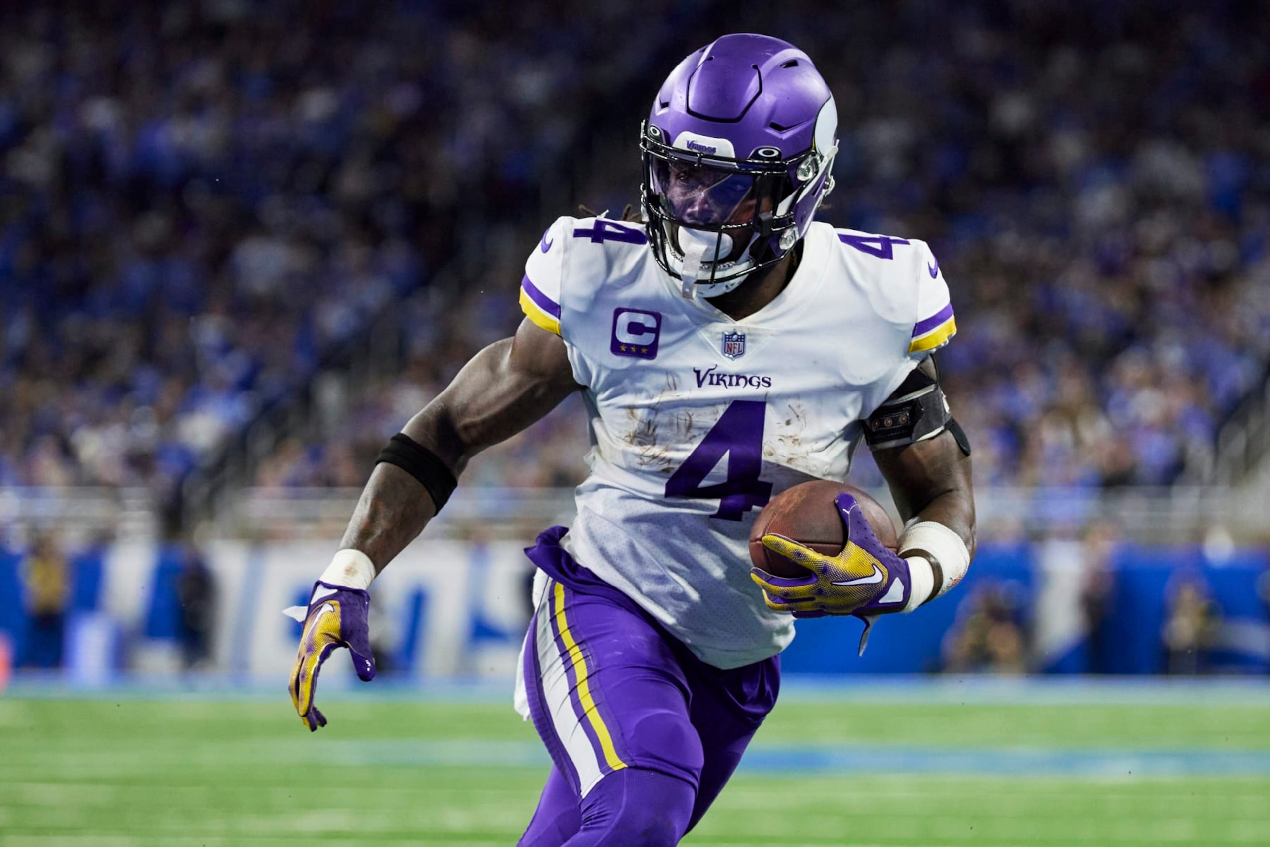 Minnesota Vikings running back Dalvin Cook (4) rushes against the Detroit Lions during an NFL football game, Sunday, Dec. 11, 2022, in Detroit. (AP Photo/Rick Osentoski)