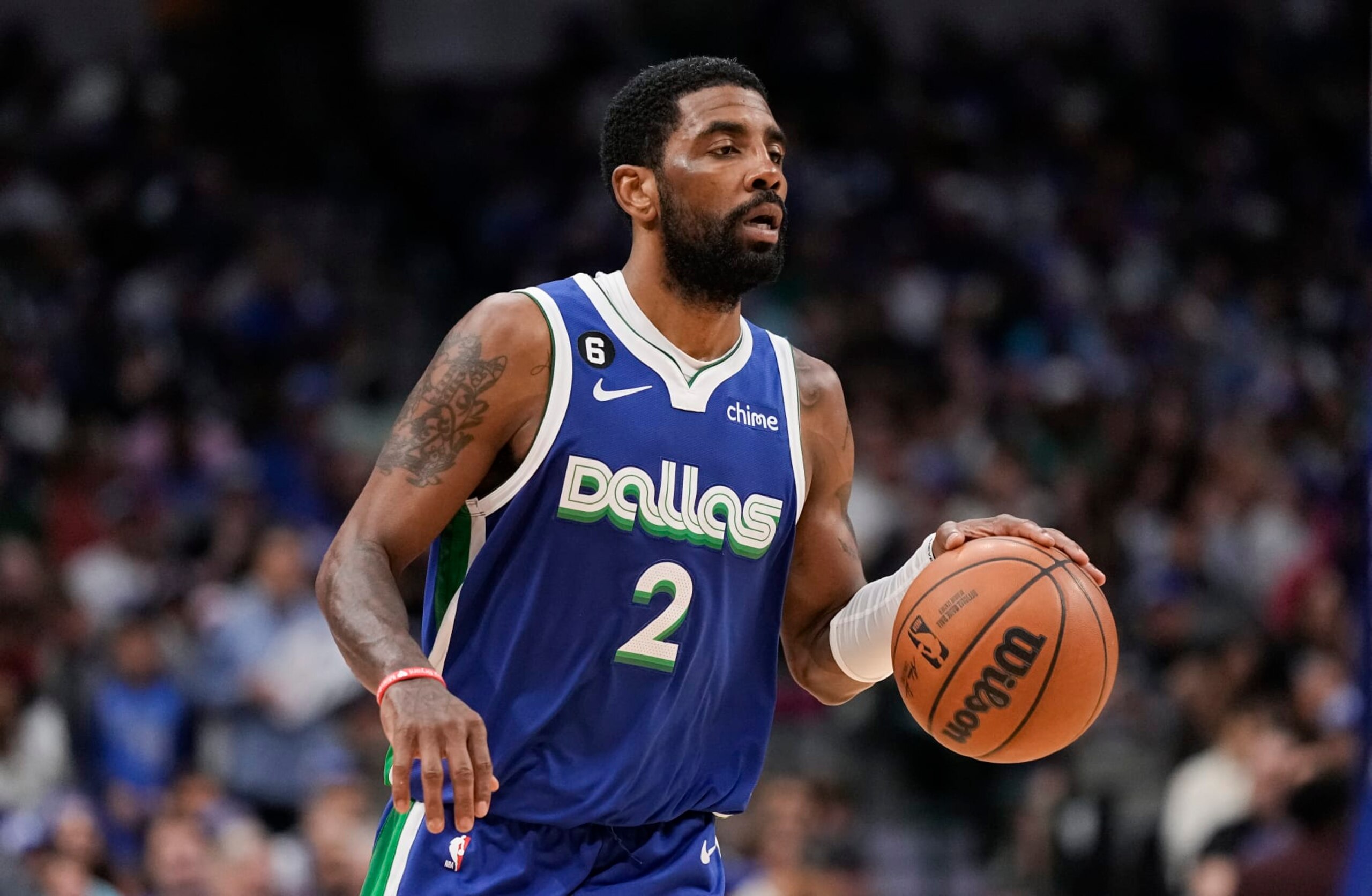 Dallas Mavericks guard Kyrie Irving (2) brings the ball up court during the second half of an NBA basketball game against the Sacramento Kings in Dallas, Wednesday, April 5, 2023. (AP Photo/Sam Hodde)