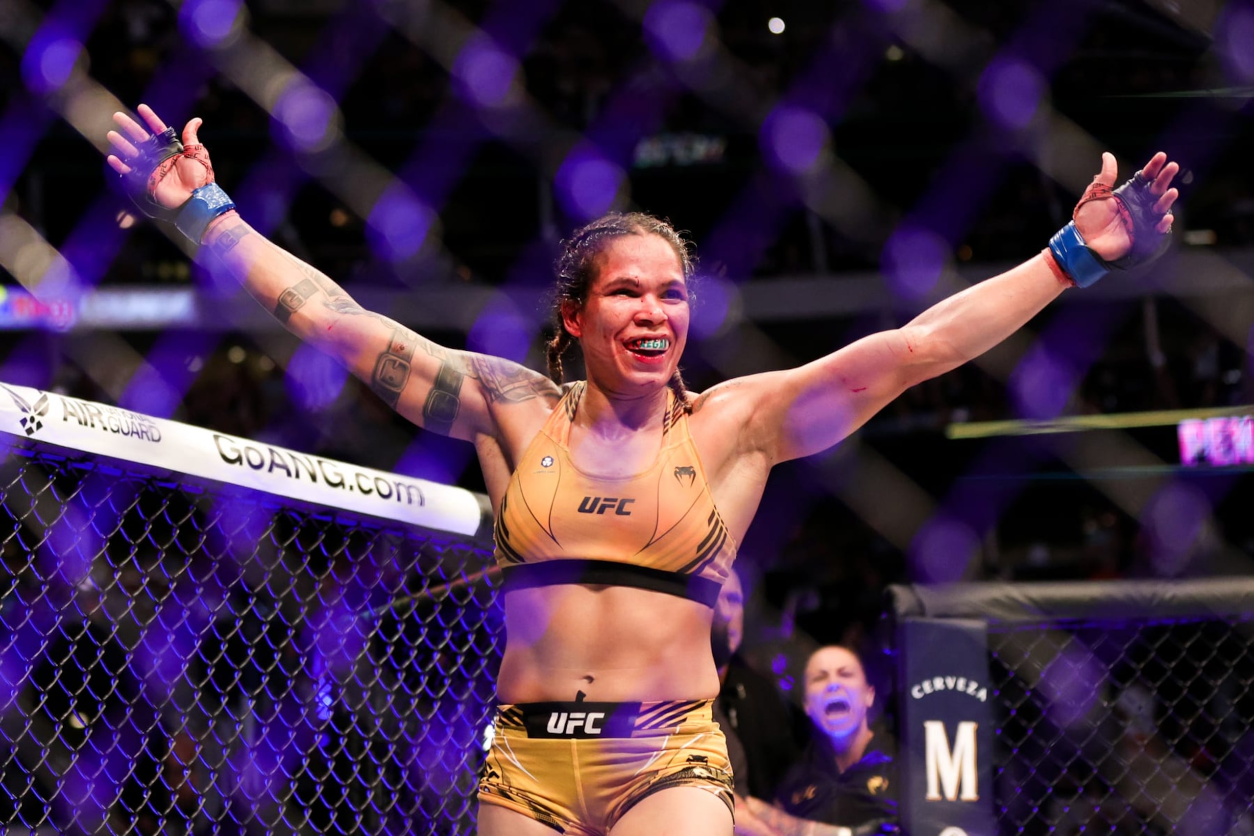 DALLAS, TEXAS - JULY 30: Amanda Nunes of Brazil celebrates after defeating Julianna Pena in their bantamweight title bout during UFC 277 at American Airlines Center on July 30, 2022 in Dallas, Texas. Amanda Nunes won via unanimous decision. (Photo by Carmen Mandato/Getty Images)