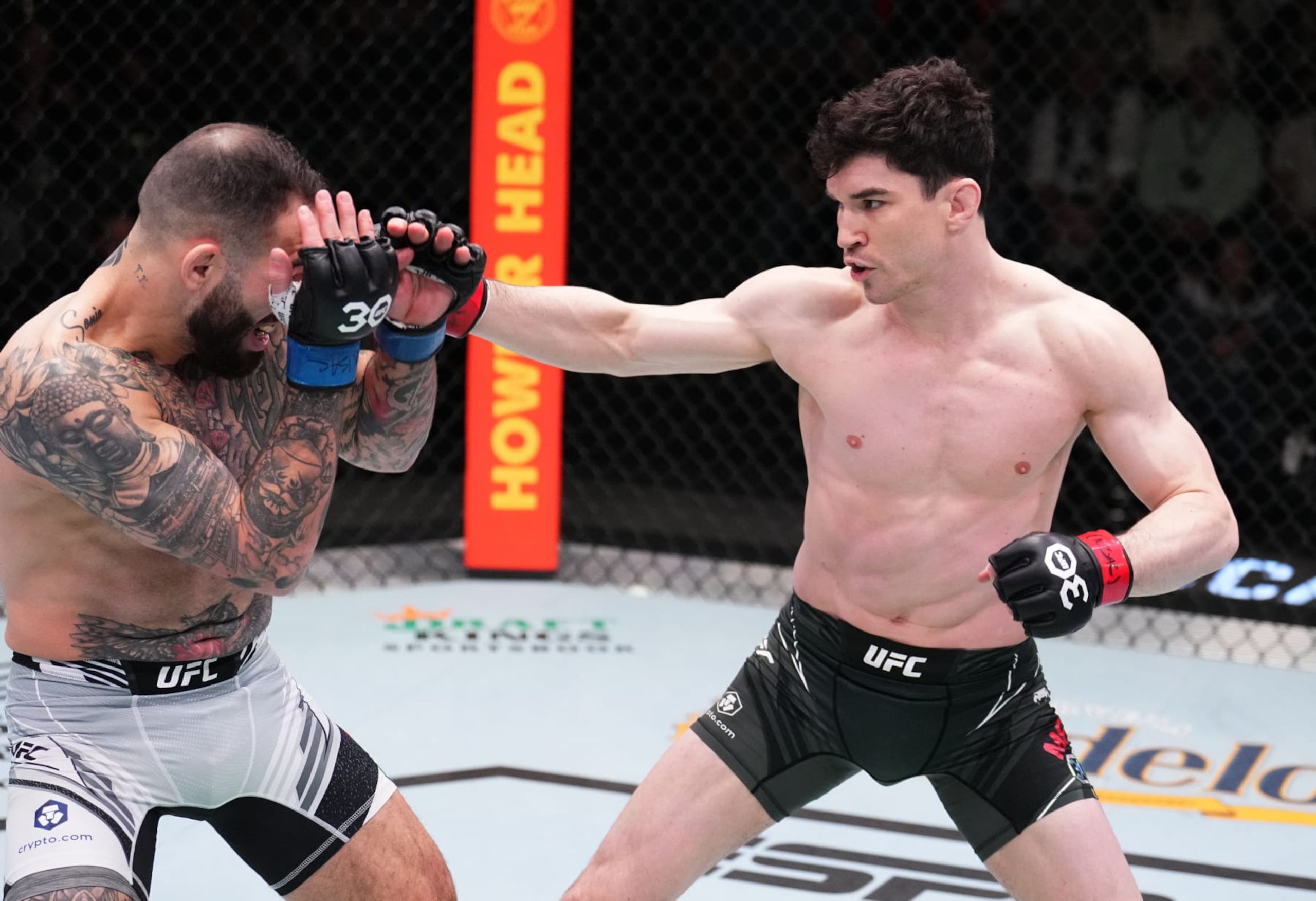 LAS VEGAS, NEVADA - FEBRUARY 25: (R-L) Mike Malott battles Yohan Lainesse of Canada in a welterweight fight during the UFC Fight Night event at UFC APEX on February 25, 2023 in Las Vegas, Nevada. (Photo by Chris Unger/Zuffa LLC via Getty Images)