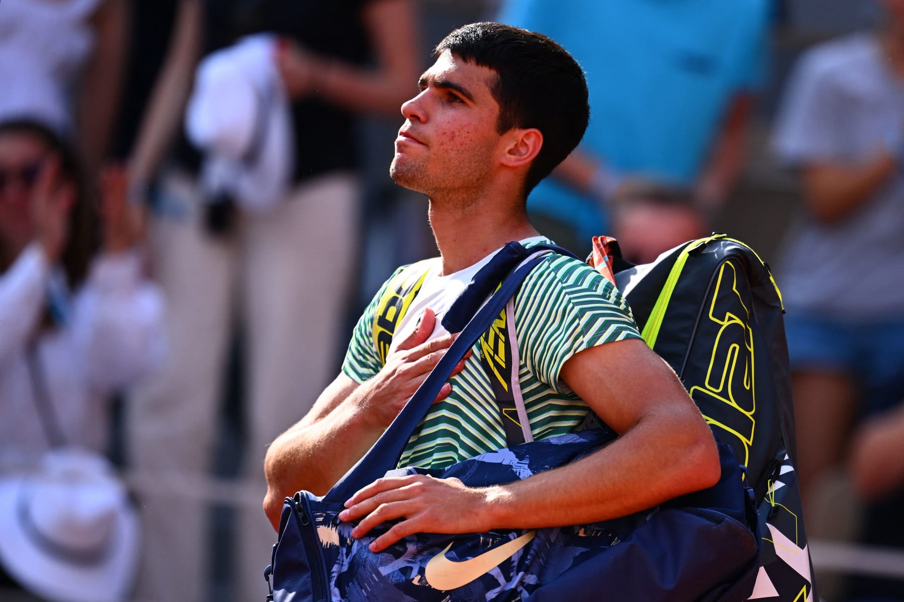 Spain's Carlos Alcaraz Garfia gestures as he leaves the court after being defeated by Serbia's Novak Djokovic during their men's singles semi-final match on day thirteen of the Roland-Garros Open tennis tournament at the Court Philippe-Chatrier in Paris on June 9, 2023. (Photo by Emmanuel DUNAND / AFP) (Photo by EMMANUEL DUNAND/AFP via Getty Images)