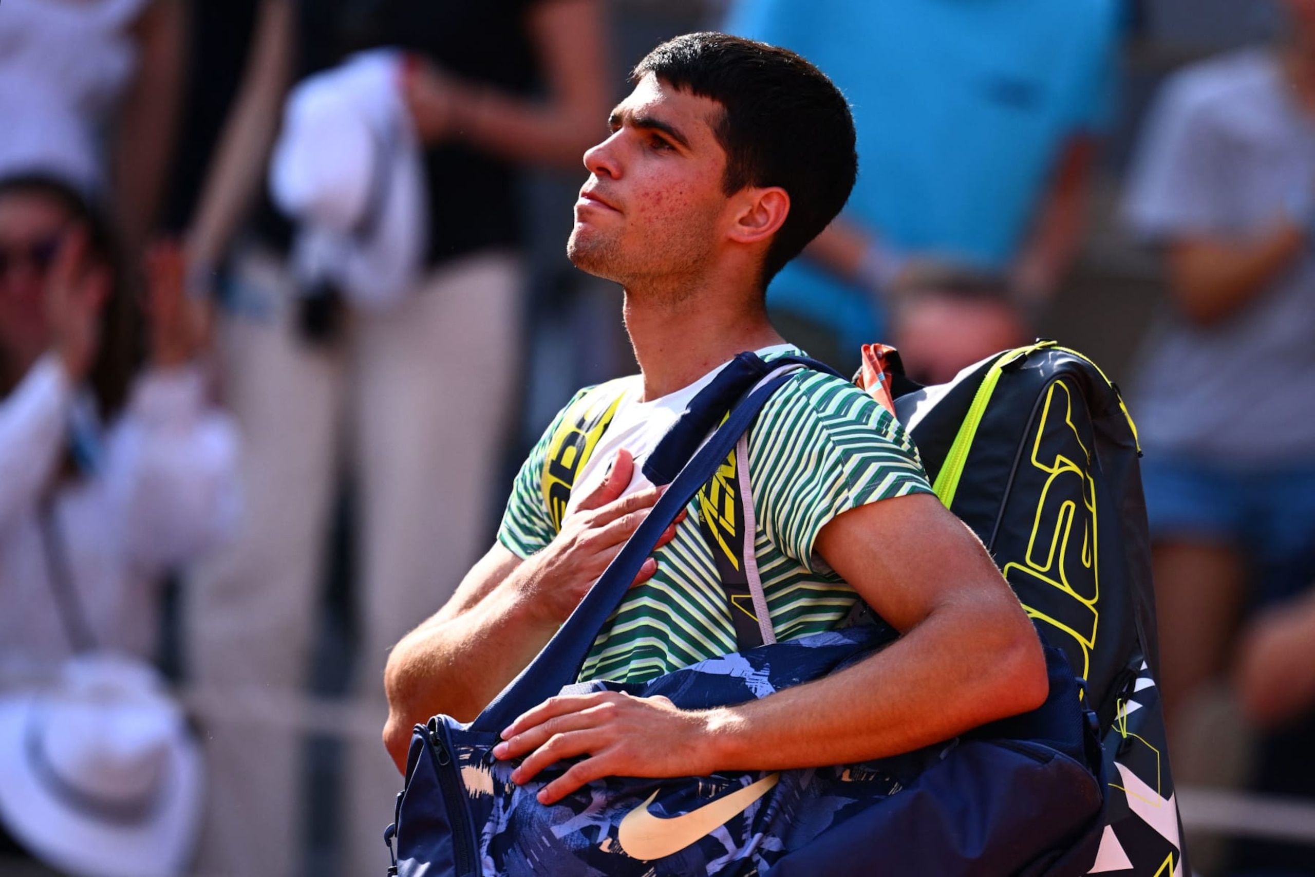 Spain's Carlos Alcaraz Garfia gestures as he leaves the court after being defeated by Serbia's Novak Djokovic during their men's singles semi-final match on day thirteen of the Roland-Garros Open tennis tournament at the Court Philippe-Chatrier in Paris on June 9, 2023. (Photo by Emmanuel DUNAND / AFP) (Photo by EMMANUEL DUNAND/AFP via Getty Images)