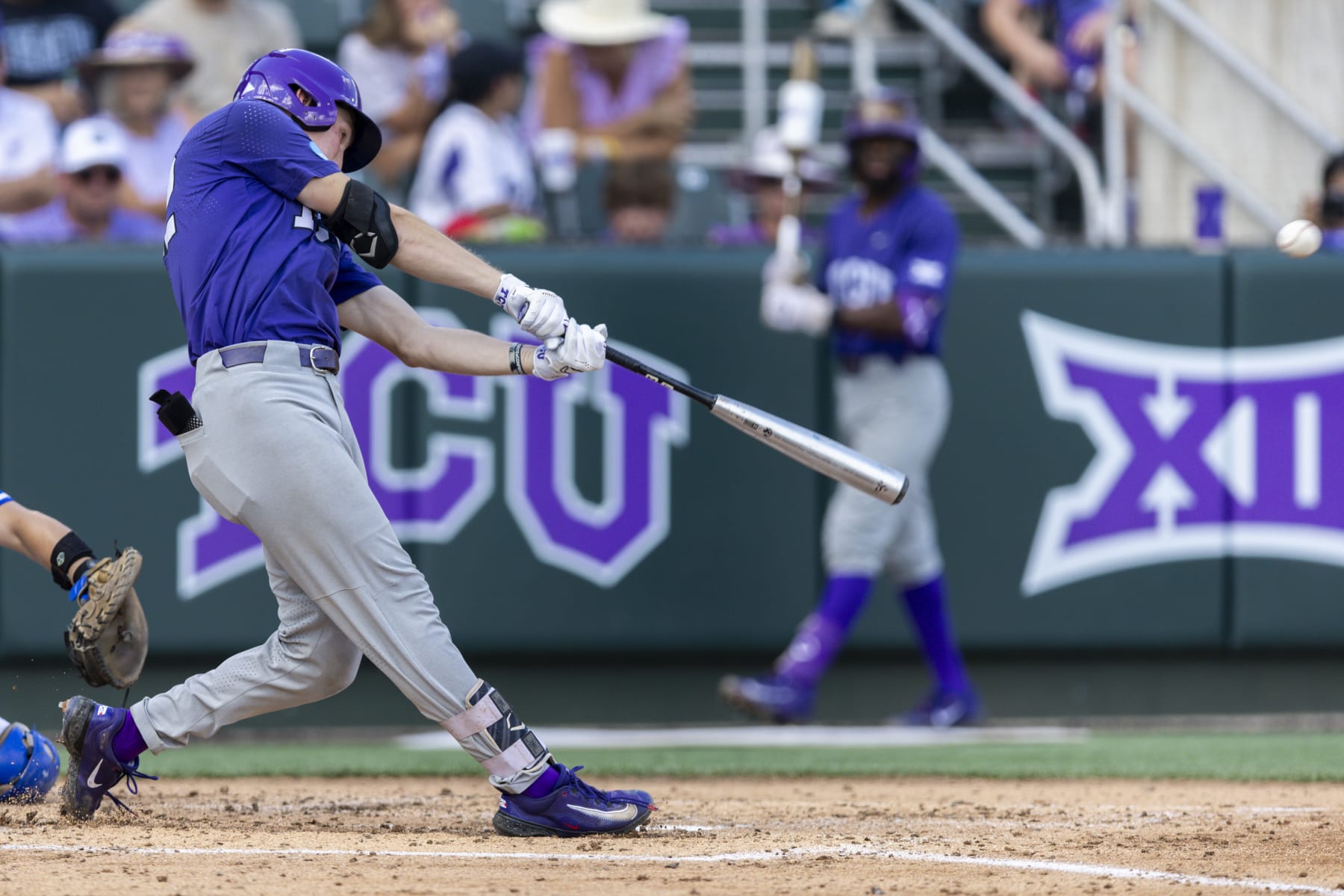 TCU's Cole Fontenelle connects for a two-run home run in the third inning of an NCAA college baseball super regional game against Indiana State in Fort Worth, Texas, Friday, June 9, 2023. (AP Photo/Brandon Wade)