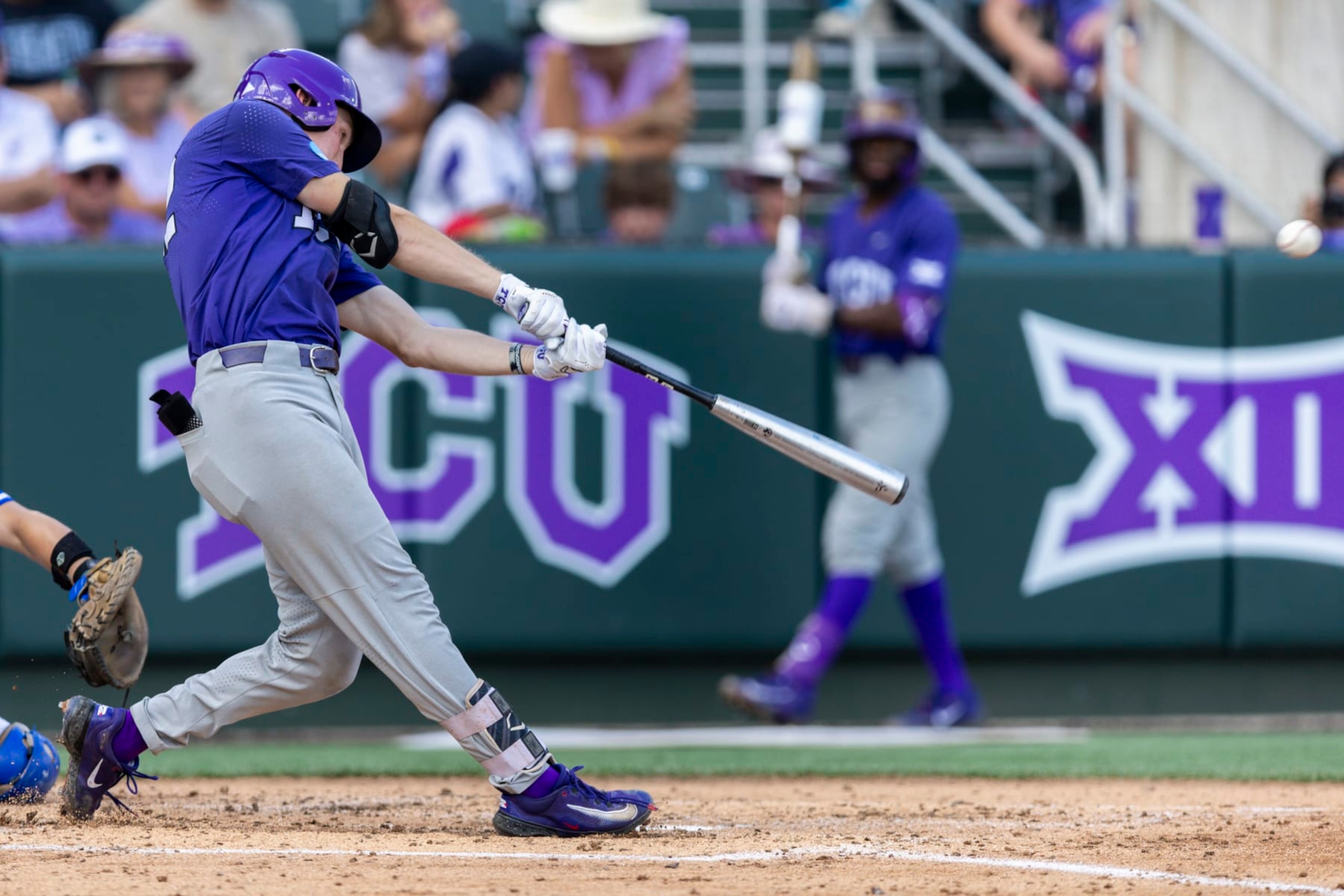 TCU's Cole Fontenelle connects for a two-run home run in the third inning of an NCAA college baseball super regional game against Indiana State in Fort Worth, Texas, Friday, June 9, 2023. (AP Photo/Brandon Wade)