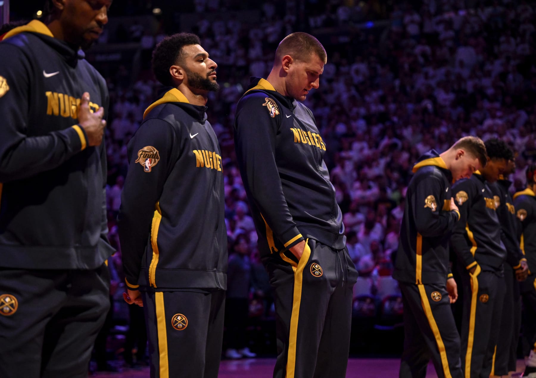 MIAMI, FL - JUNE 9: Jamal Murray (27) and Nikola Jokic (15) of the Denver Nuggets stand for the national anthem before the first half of the Nuggets' 108-95 win over the Miami Heat during Game 4 of the NBA Finals at the Kaseya Center in Miami on Friday, June 9, 2023. (Photo by AAron Ontiveroz/The Denver Post)