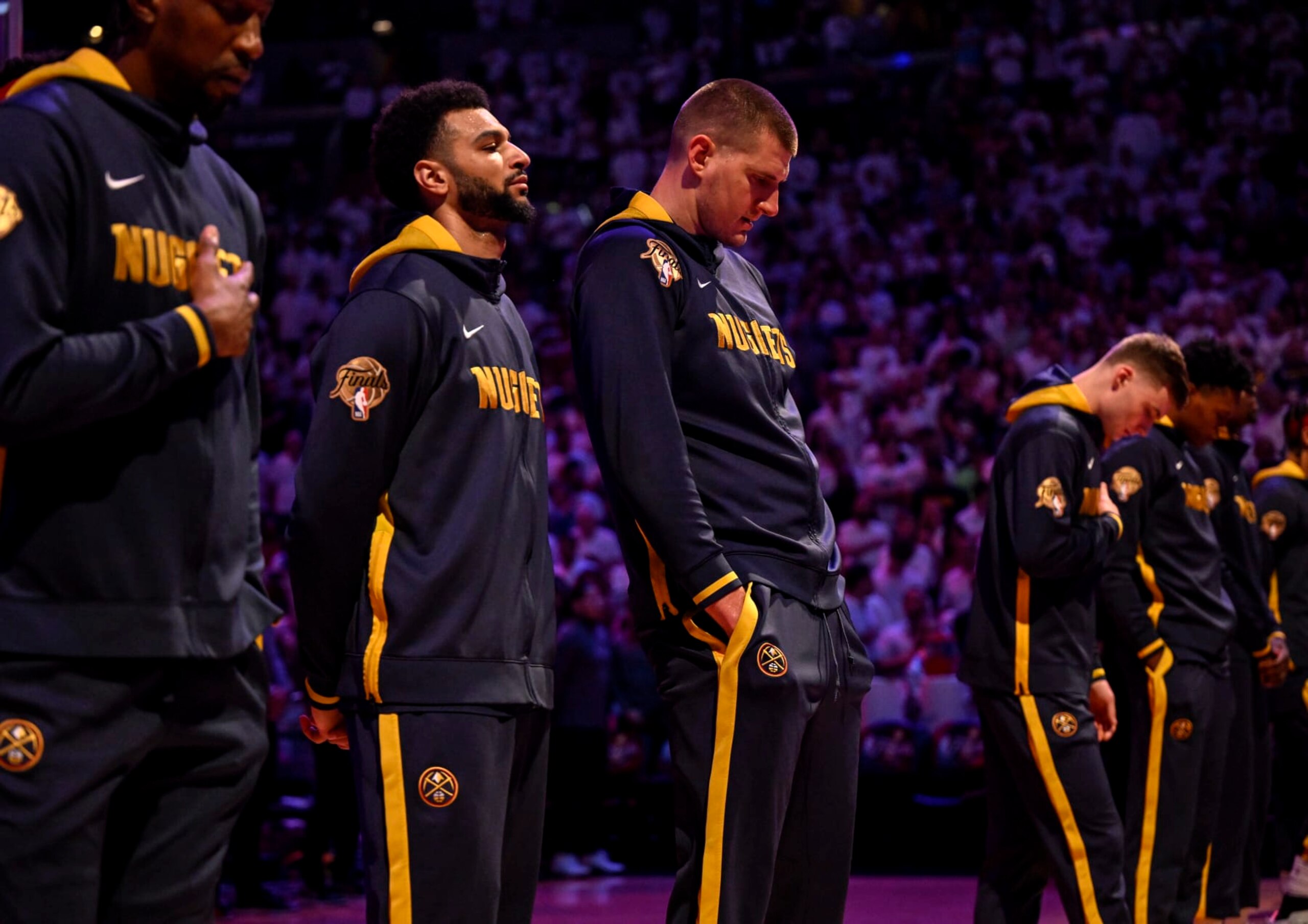 MIAMI, FL - JUNE 9: Jamal Murray (27) and Nikola Jokic (15) of the Denver Nuggets stand for the national anthem before the first half of the Nuggets' 108-95 win over the Miami Heat during Game 4 of the NBA Finals at the Kaseya Center in Miami on Friday, June 9, 2023. (Photo by AAron Ontiveroz/The Denver Post)