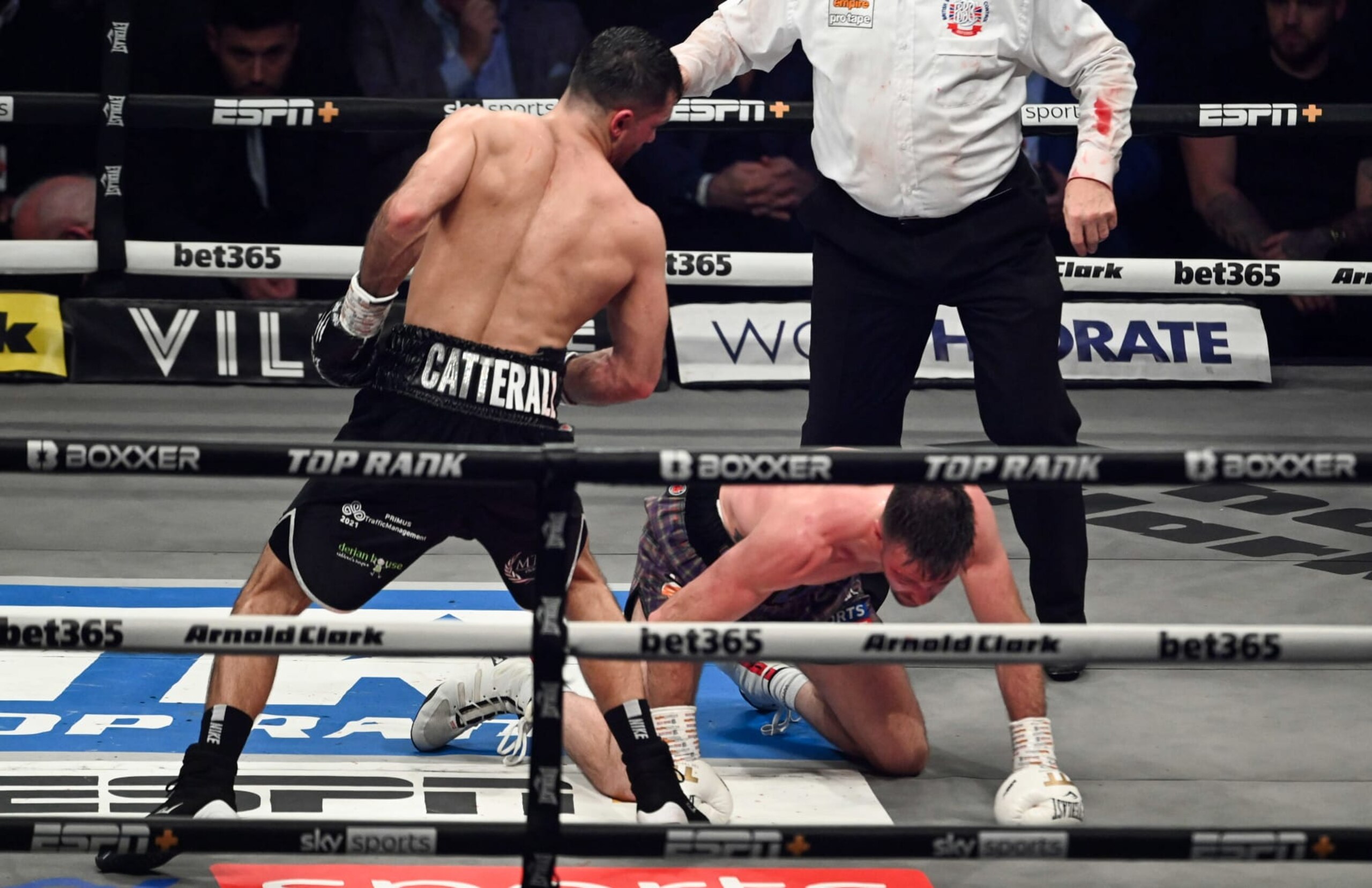 GLASGOW, SCOTLAND - FEBRUARY 26: Josh Taylor (R) is knocked down by Jack Catterall during the WBA, WBC, WBO & IBF world super-lightweight title fight at the OVO Hydro, on February 26, in Glasgow, Scotland.  (Photo by Paul Devlin/SNS Group via Getty Images)