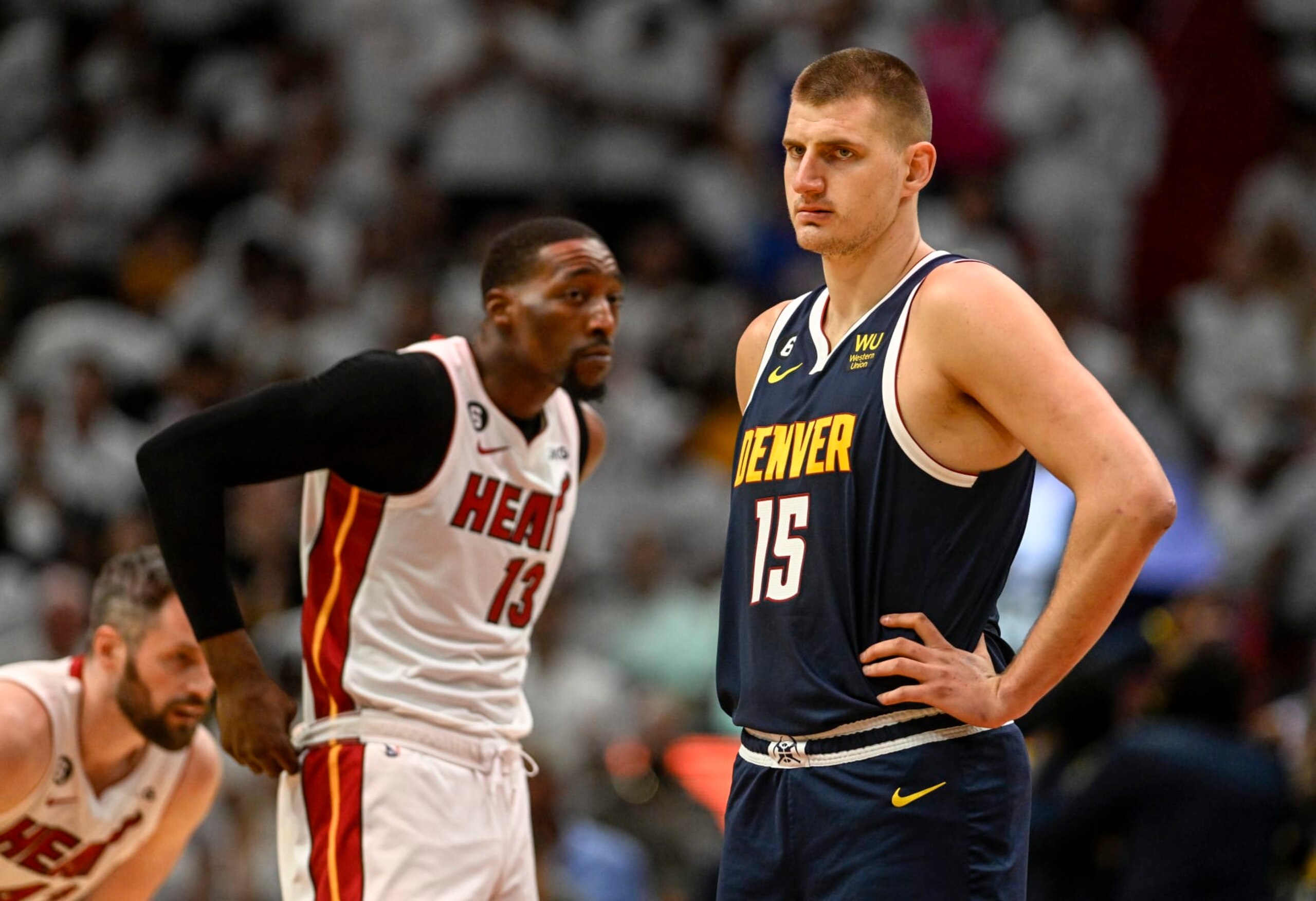 MIAMI, FL - JUNE 9: Nikola Jokic (15) of the Denver Nuggets and Bam Adebayo (13) of the Miami Heat prepare to tip off in the first half of the Nuggets' 108-95 win during Game 4 of the NBA Finals at the Kaseya Center in Miami on Friday, June 9, 2023. (Photo by AAron Ontiveroz/The Denver Post)