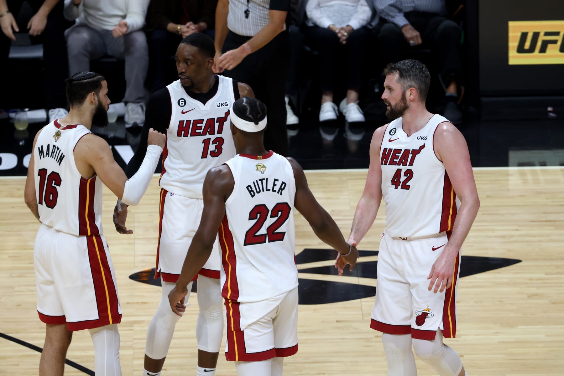 MIAMI, FL - JUNE 9: Caleb Martin #16, Bam Adebayo #13, Jimmy Butler #22, and Kevin Love #42 of the Miami Heat huddle up on the court during the game against the Denver Nuggets during Game Four of the 2023 NBA Finals on June 9, 2023 at Kaseya Center in Miami, Florida. NOTE TO USER: User expressly acknowledges and agrees that, by downloading and or using this Photograph, user is consenting to the terms and conditions of the Getty Images License Agreement. Mandatory Copyright Notice: Copyright 2023 NBAE (Photo by Robby Illanes/NBAE via Getty Images)