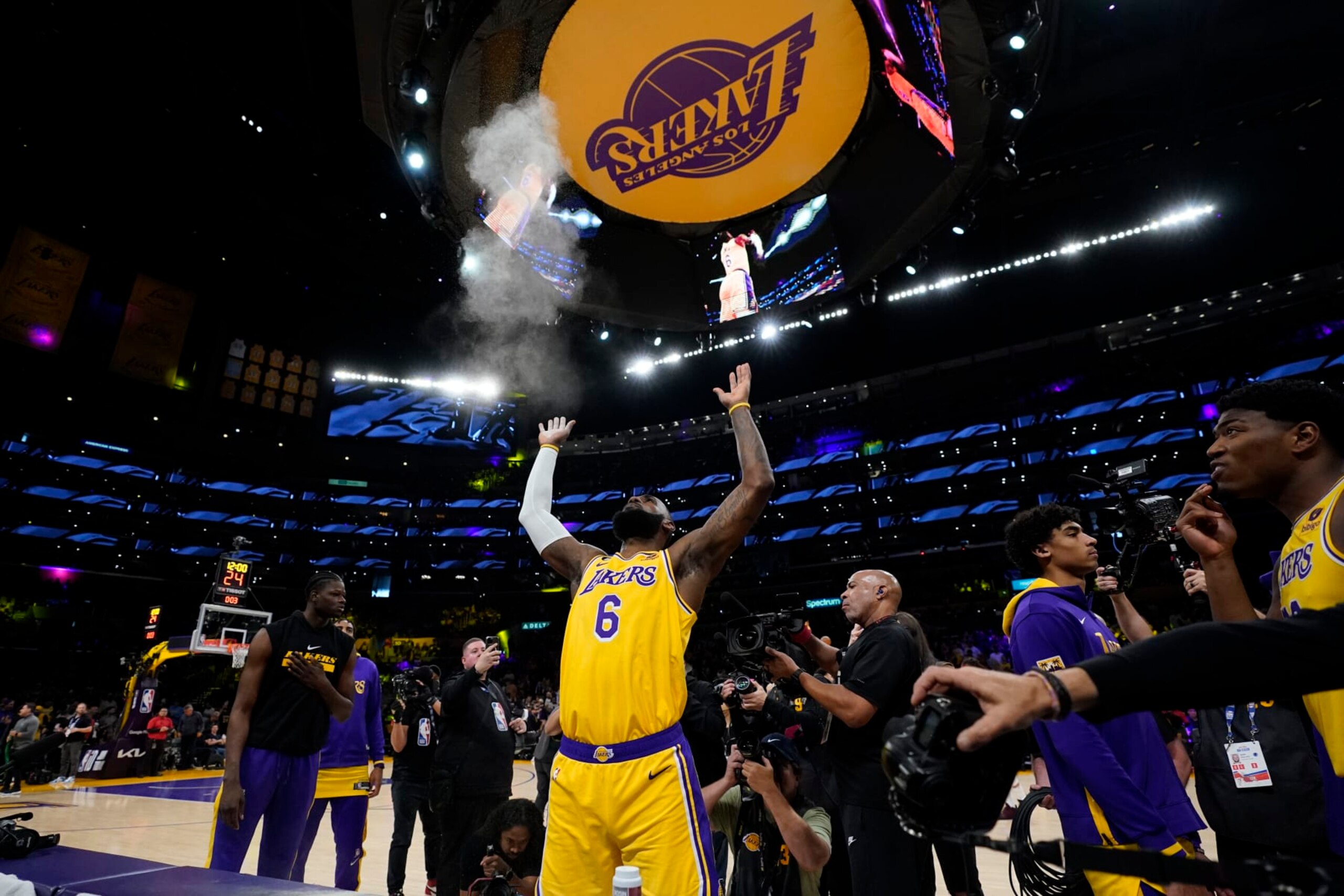 Los Angeles Lakers forward LeBron James throws chalk in the air before Game 4 of the NBA basketball Western Conference Final series against the Denver Nuggets Monday, May 22, 2023, in Los Angeles. (AP Photo/Ashley Landis)
