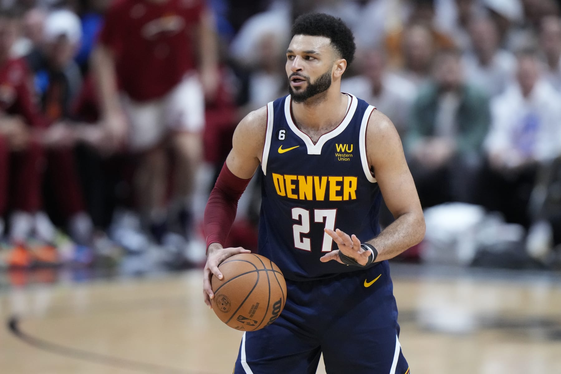 Denver Nuggets guard Jamal Murray (27) looks to pass during the first half of Game 4 of the basketball NBA Finals against the Miami Heat, Friday, June 9, 2023, in Miami. (AP Photo/Wilfredo Lee)