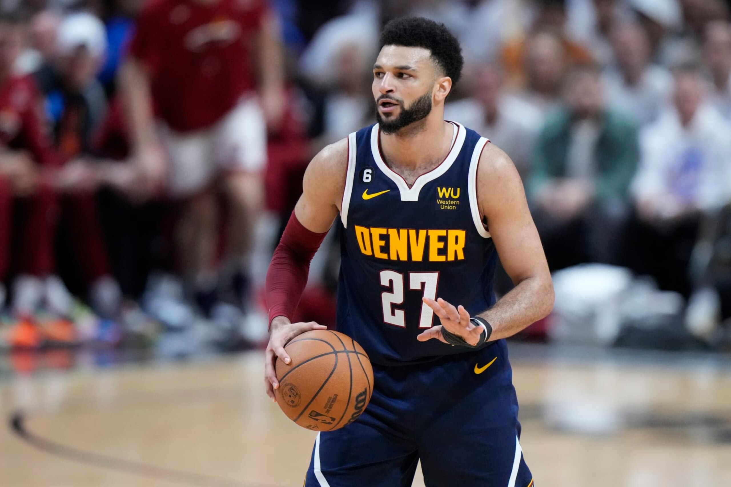 Denver Nuggets guard Jamal Murray (27) looks to pass during the first half of Game 4 of the basketball NBA Finals against the Miami Heat, Friday, June 9, 2023, in Miami. (AP Photo/Wilfredo Lee)