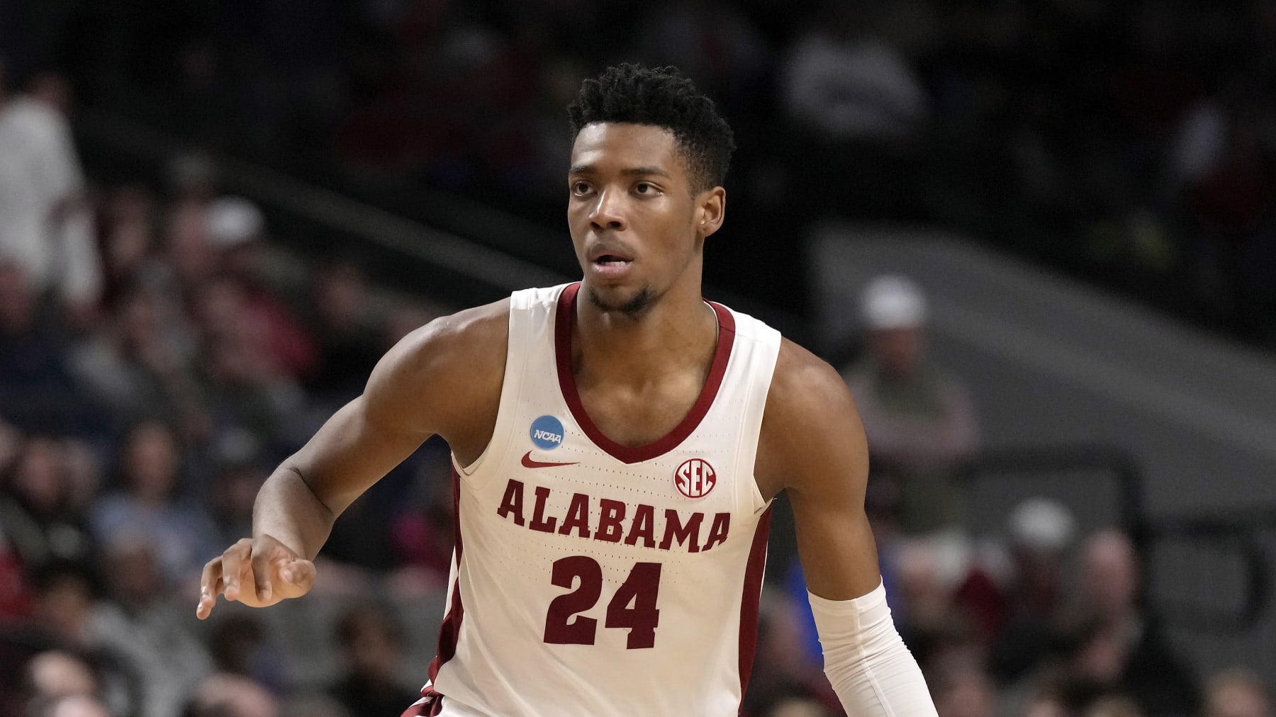 Alabama forward Brandon Miller (24) dribbles up court in the second half of a second-round college basketball game against Maryland in the NCAA Tournament in Birmingham, Ala., Saturday, March 18, 2023. Alabama won 73-51. (AP Photo/Rogelio V. Solis)