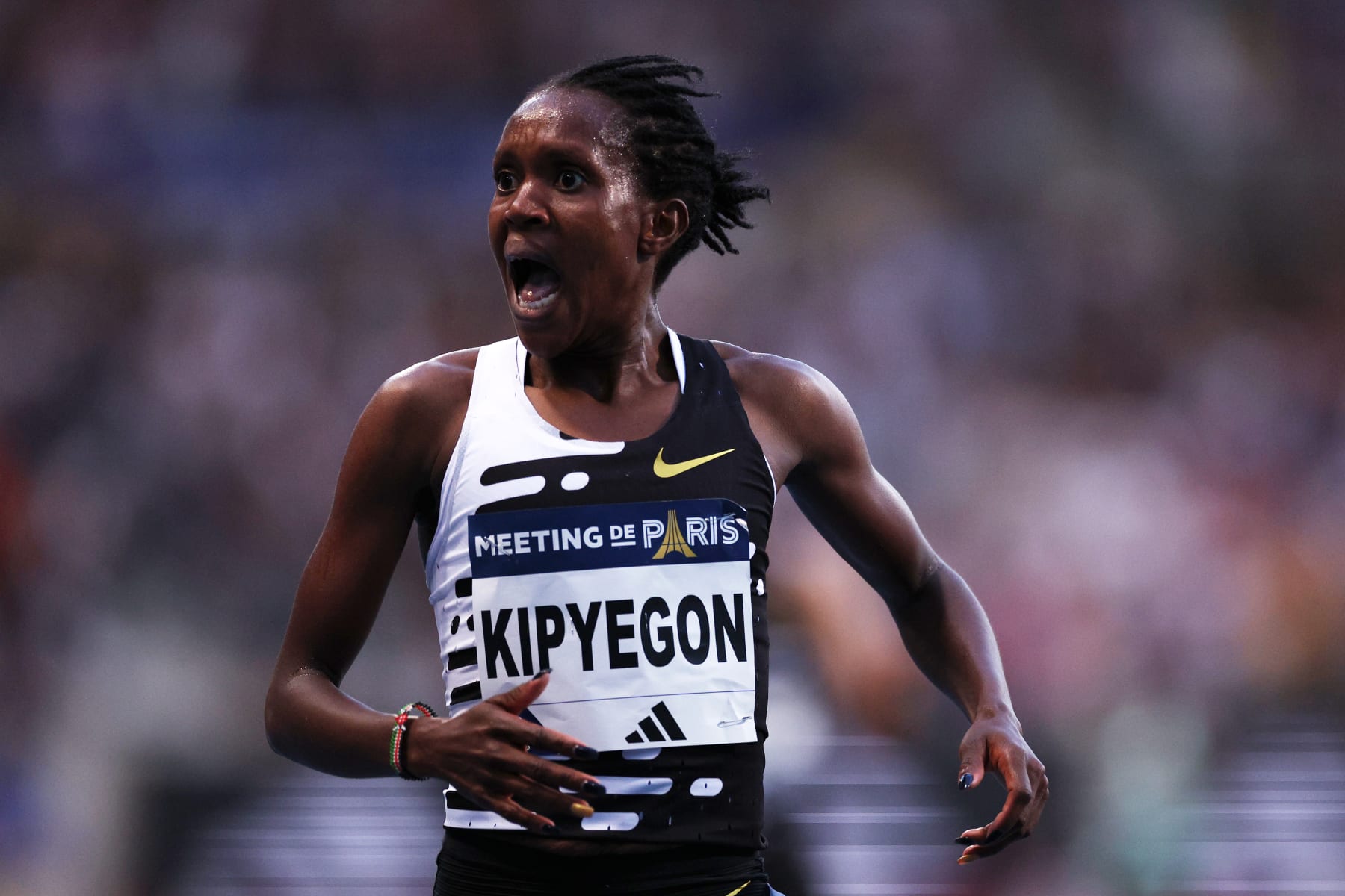 PARIS, FRANCE - JUNE 09: Faith Kipyegon of Team Kenya celebrates after winning and setting a new World Record in Women's 5000 Metres during Meeting de Paris, part of the 2023 Diamond League series at Stade Charlety on June 09, 2023 in Paris, France. (Photo by Dean Mouhtaropoulos/Getty Images)