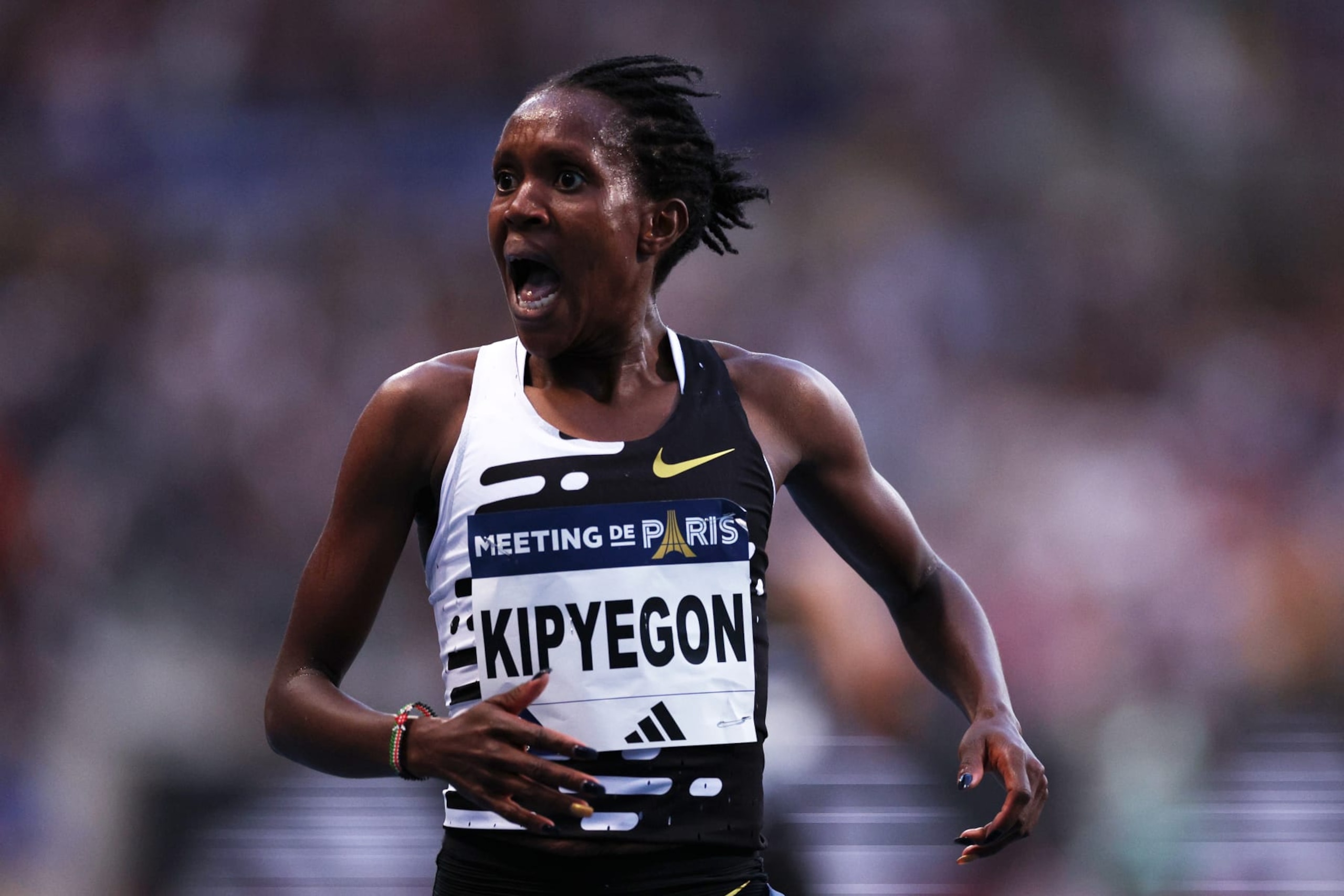 PARIS, FRANCE - JUNE 09: Faith Kipyegon of Team Kenya celebrates after winning and setting a new World Record in Women's 5000 Metres during Meeting de Paris, part of the 2023 Diamond League series at Stade Charlety on June 09, 2023 in Paris, France. (Photo by Dean Mouhtaropoulos/Getty Images)