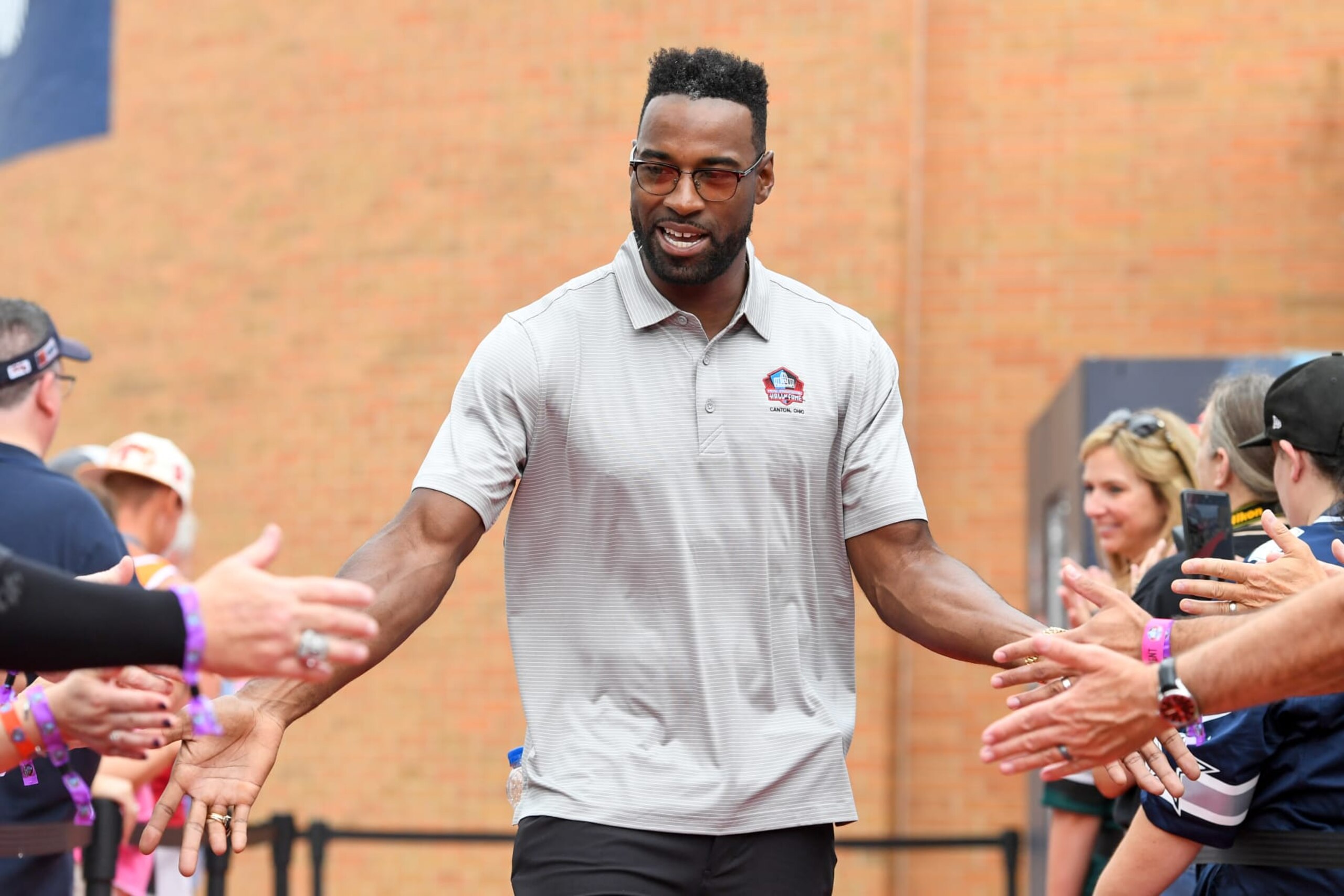 CANTON, OH - AUGUST 06: Hall of Fame wide receiver Calvin Johnson celebrates with fans as he is introduced prior to the Pro Football Hall of Fame Enshrinement on August 06, 2022 in Canton, Ohio. (Photo by Nick Cammett/Diamond Images via Getty Images)