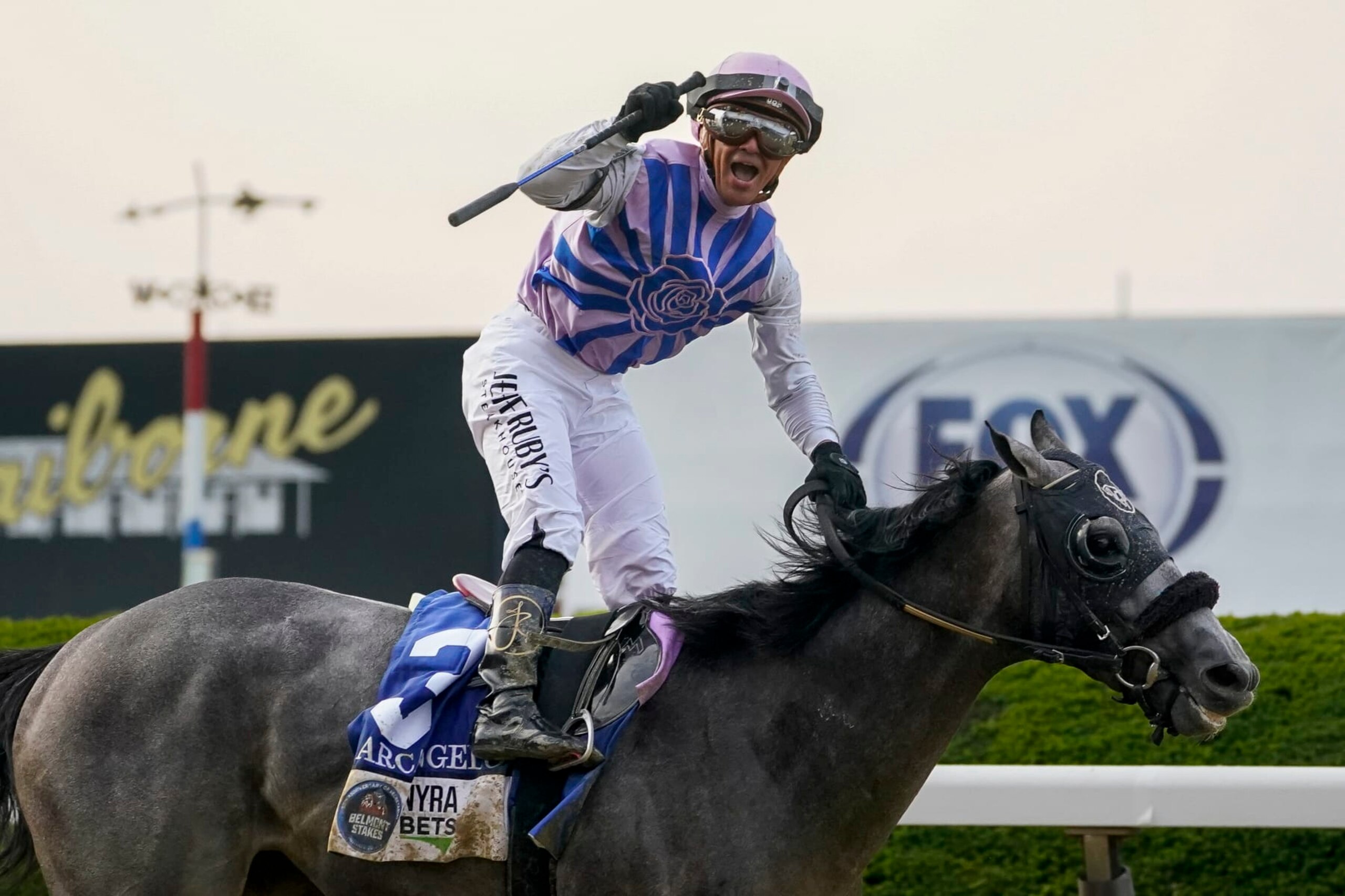 Jockey Javier Castellano, atop Arcangelo, celebrates after crossing the finish line to win the 155th running of the Belmont Stakes horse race, Saturday, June 10, 2023, at Belmont Park in Elmont, N.Y. (AP Photo/John Minchillo)