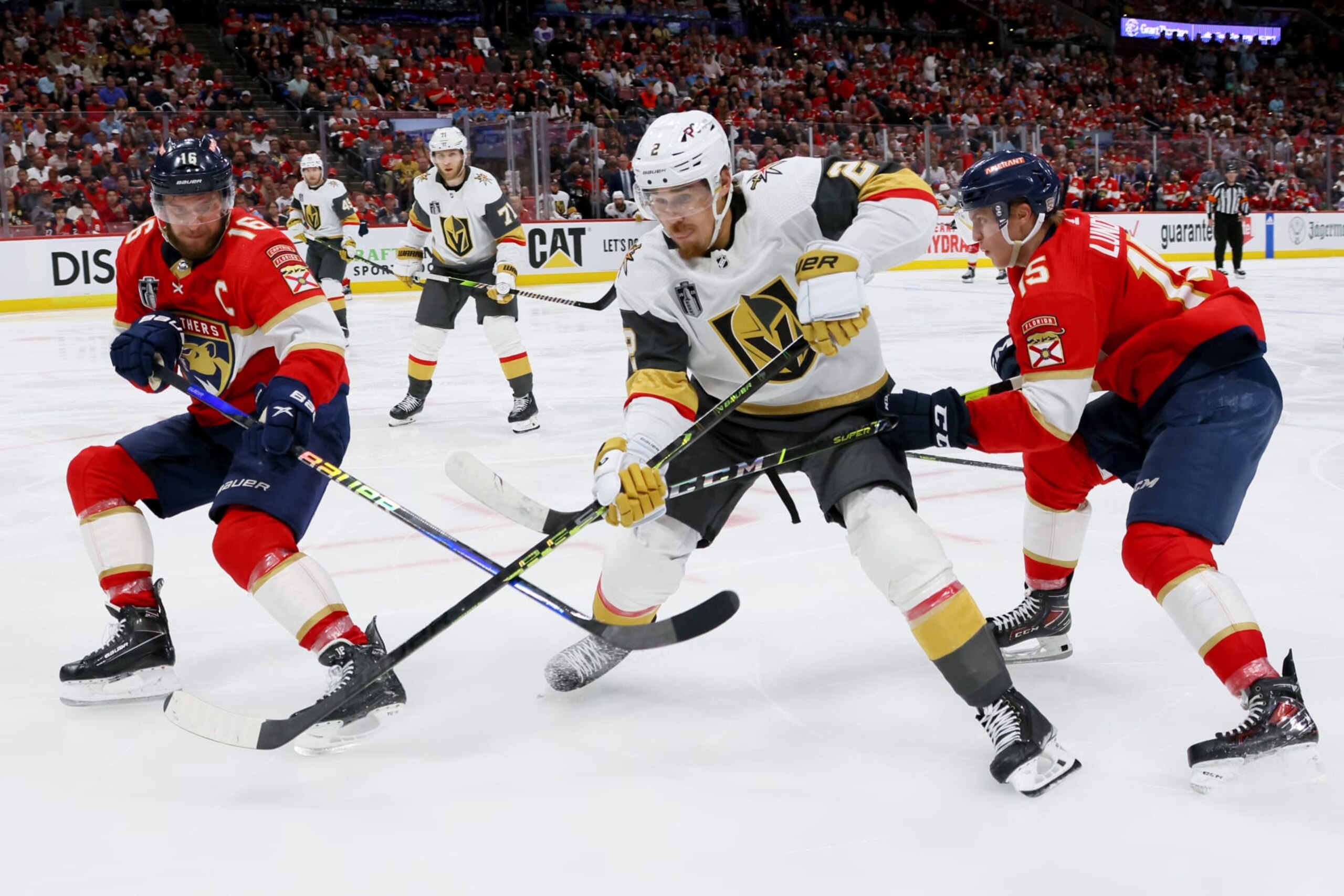 SUNRISE, FLORIDA - JUNE 10:  Zach Whitecloud #2 of the Vegas Golden Knights skates against Aleksander Barkov #16 and Anton Lundell #15 of the Florida Panthers during the third period in Game Four of the 2023 NHL Stanley Cup Final at FLA Live Arena on June 10, 2023 in Sunrise, Florida. (Photo by Bruce Bennett/Getty Images)