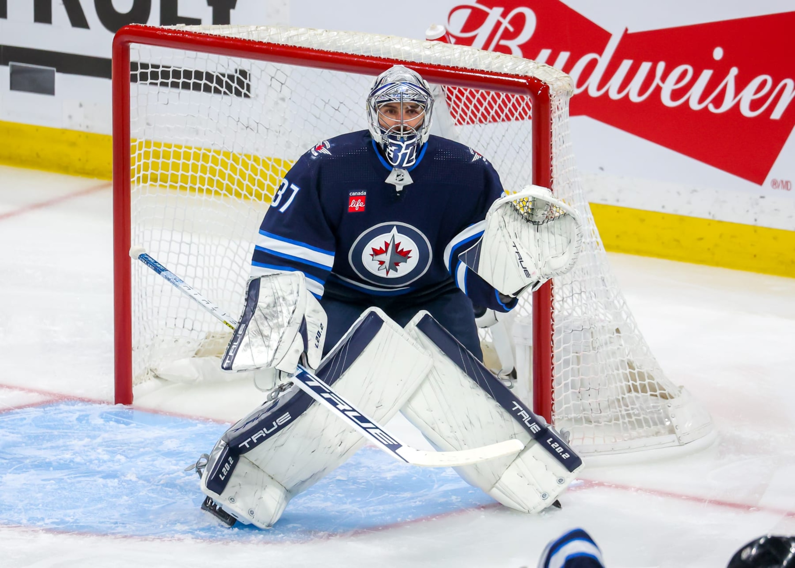 WINNIPEG, CANADA - APRIL 22: Goaltender Connor Hellebuyck #37 of the Winnipeg Jets guards the net during first period action against the Vegas Golden Knights in Game Three of the First Round of the 2023 Stanley Cup Playoffs at Canada Life Centre on April 22, 2023 in Winnipeg, Manitoba, Canada. (Photo by Jonathan Kozub/NHLI via Getty Images) WINNIPEG, CANADA - APRIL 22: Goaltender Connor Hellebuyck #37 of the Winnipeg Jets guards the net during first period action against the Vegas Golden Knights in Game Three of the First Round of the 2023 Stanley Cup Playoffs at Canada Life Centre on April 22, 2023 in Winnipeg, Manitoba, Canada. (Photo by Jonathan Kozub/NHLI via Getty Images)