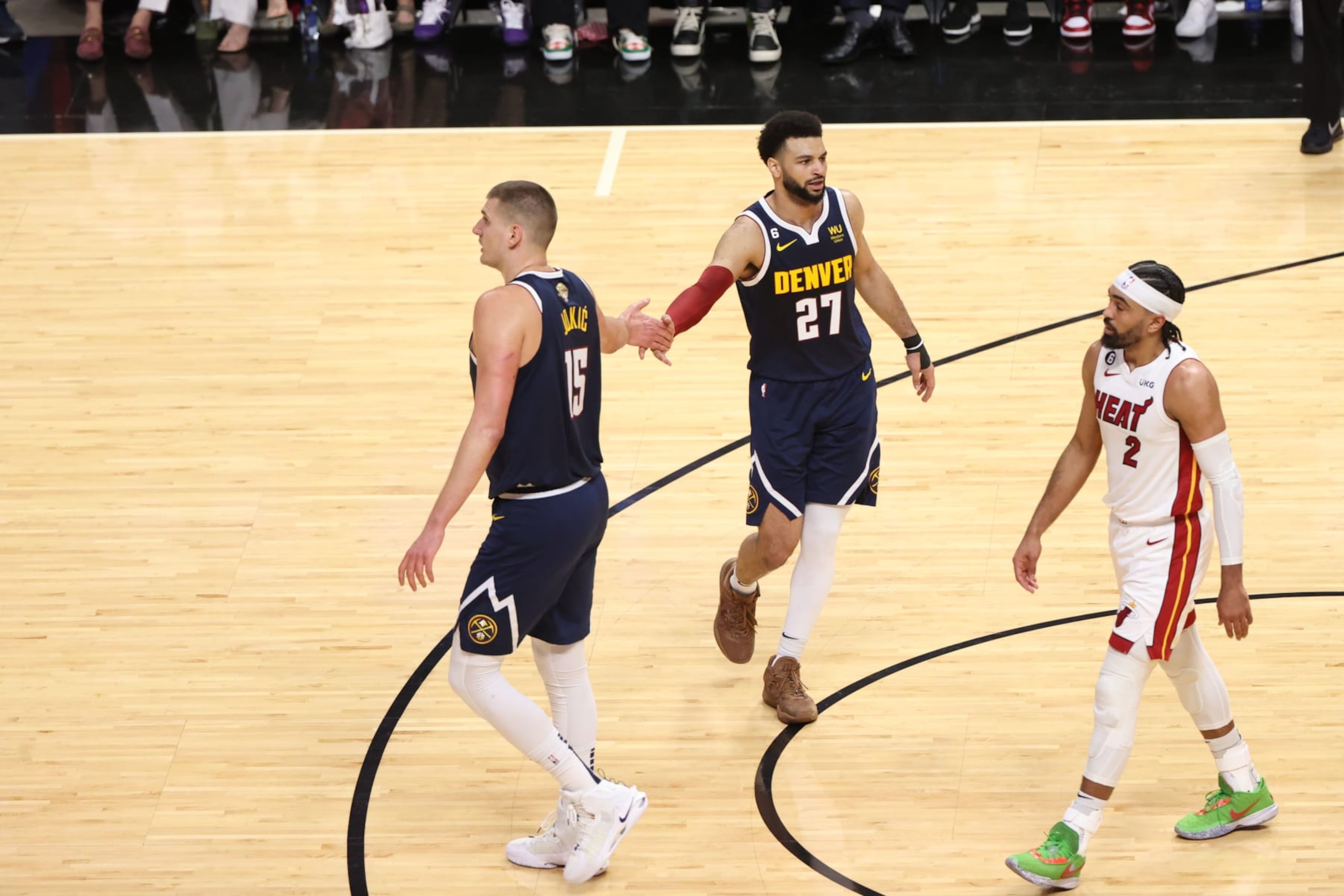 MIAMI, FL - JUNE 9: Nikola Jokic #15 and Jamal Murray #27 of the Denver Nuggets high five during the game against the Miami Heat during Game Four of the 2023 NBA Finals on June 9, 2023 at Kaseya Center in Miami, Florida. NOTE TO USER: User expressly acknowledges and agrees that, by downloading and or using this Photograph, user is consenting to the terms and conditions of the Getty Images License Agreement. Mandatory Copyright Notice: Copyright 2023 NBAE (Photo by Joe Murphy/NBAE via Getty Images)