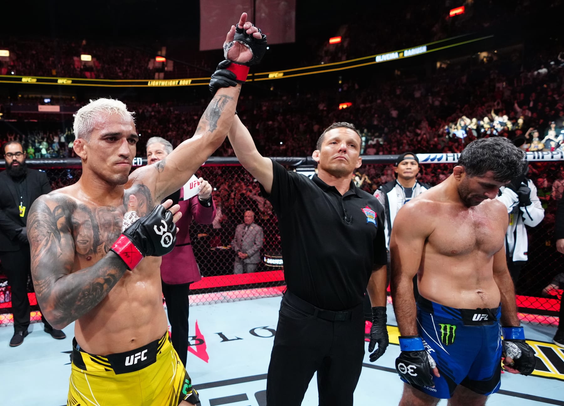 VANCOUVER, BRITISH COLUMBIA - JUNE 10: (L-R) Charles Oliveira of Brazil celebrates his TKO victory over Beneil Dariush of Iran in their lightweight fight during the UFC 289 event at Rogers Arena on June 10, 2023 in Vancouver, Canada. (Photo by Jeff Bottari/Zuffa LLC)
