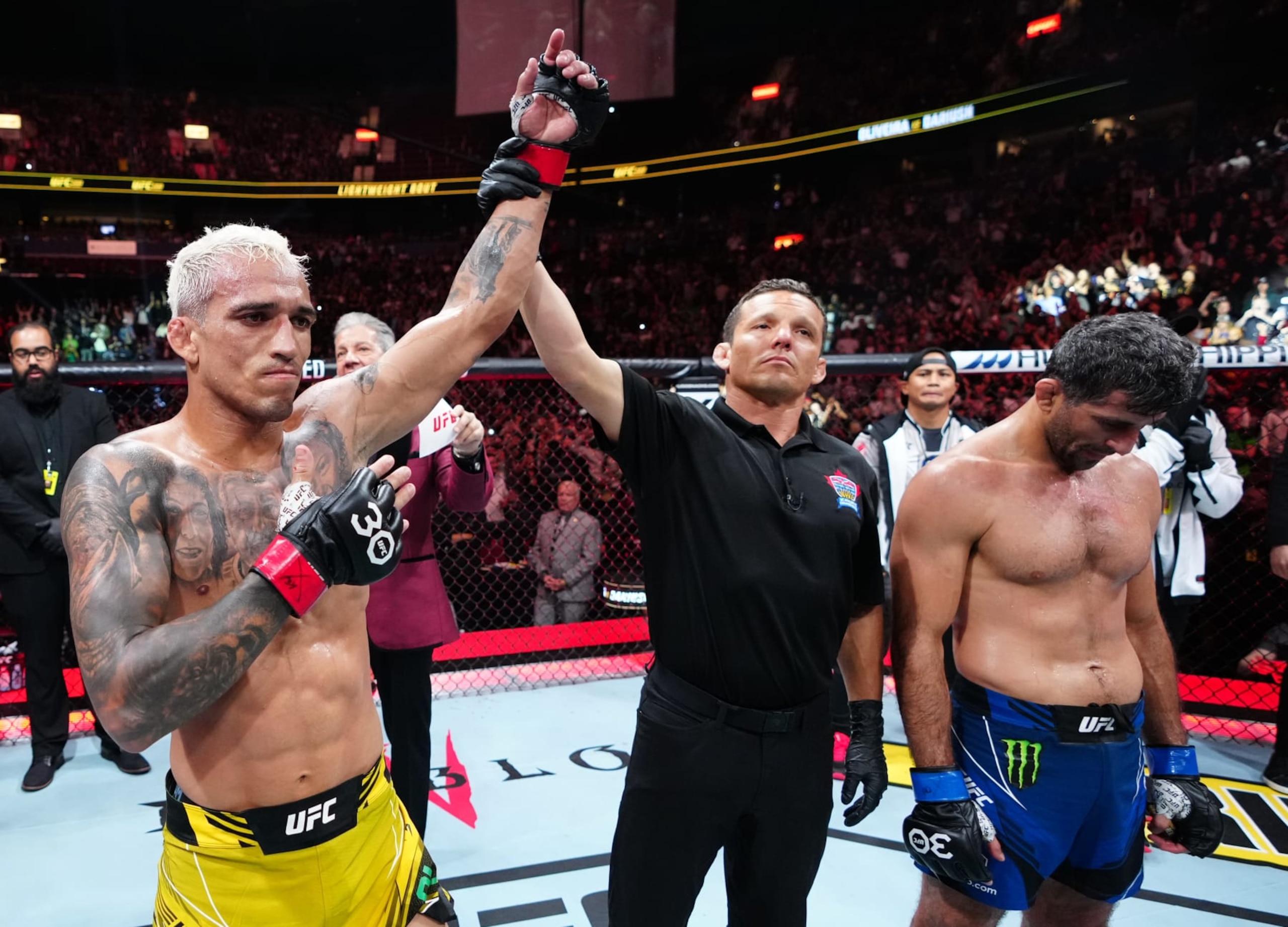 VANCOUVER, BRITISH COLUMBIA - JUNE 10: (L-R) Charles Oliveira of Brazil celebrates his TKO victory over Beneil Dariush of Iran in their lightweight fight during the UFC 289 event at Rogers Arena on June 10, 2023 in Vancouver, Canada. (Photo by Jeff Bottari/Zuffa LLC)