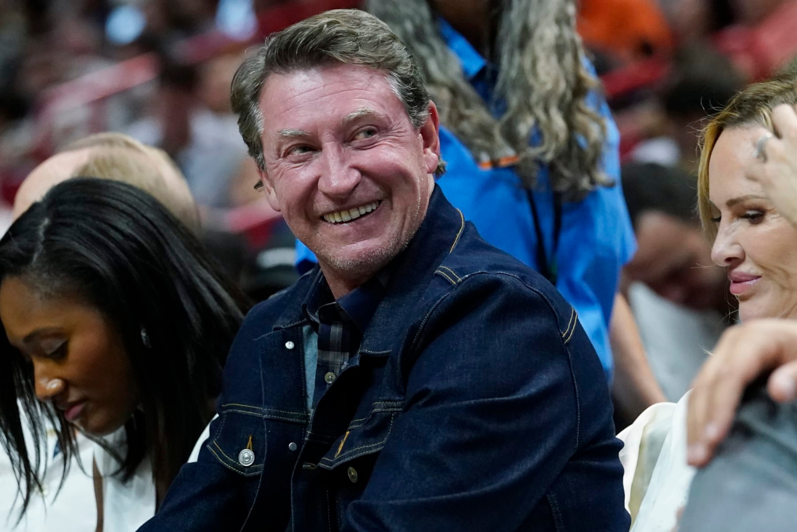 NHL Hall of Fame player Wayne Gretzky smiles during the second half of an NBA basketball game between the Miami Heat and the Phoenix Suns, Monday, Nov. 14, 2022, in Miami. (AP Photo/Marta Lavandier) NHL Hall of Fame player Wayne Gretzky smiles during the second half of an NBA basketball game between the Miami Heat and the Phoenix Suns, Monday, Nov. 14, 2022, in Miami. (AP Photo/Marta Lavandier)