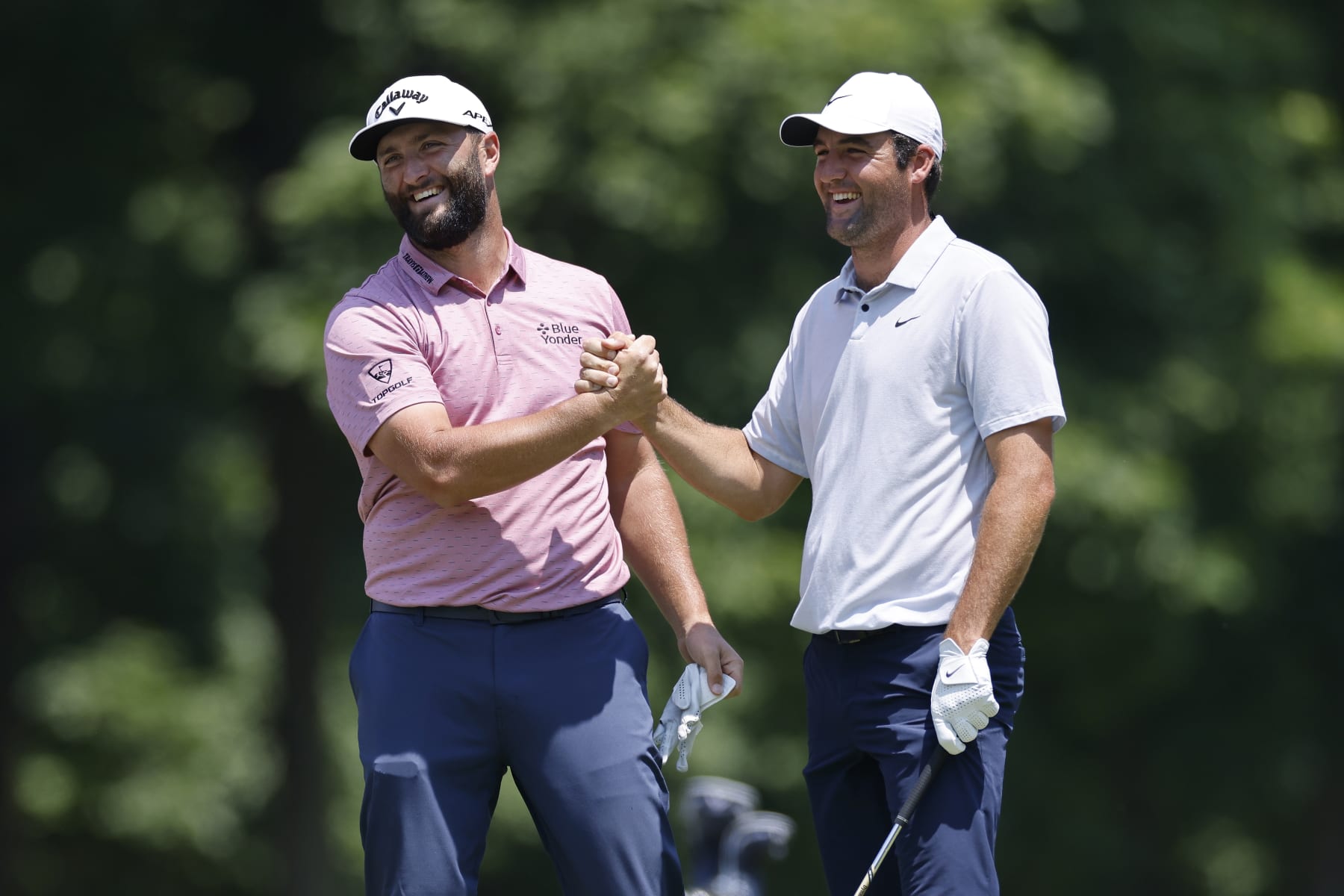 DUBLIN, OH - JUNE 04: Jon Rahm of Spain is congratulated by Scottie Scheffler of the United States after holing his approach shot from the fairway at the 9th hole for eagle during the final round of the Memorial Tournament presented by Workday at Muirfield Village Golf Club on June 04, 2023 in Dublin, Ohio. (Photo by Joe Robbins/Icon Sportswire via Getty Images)