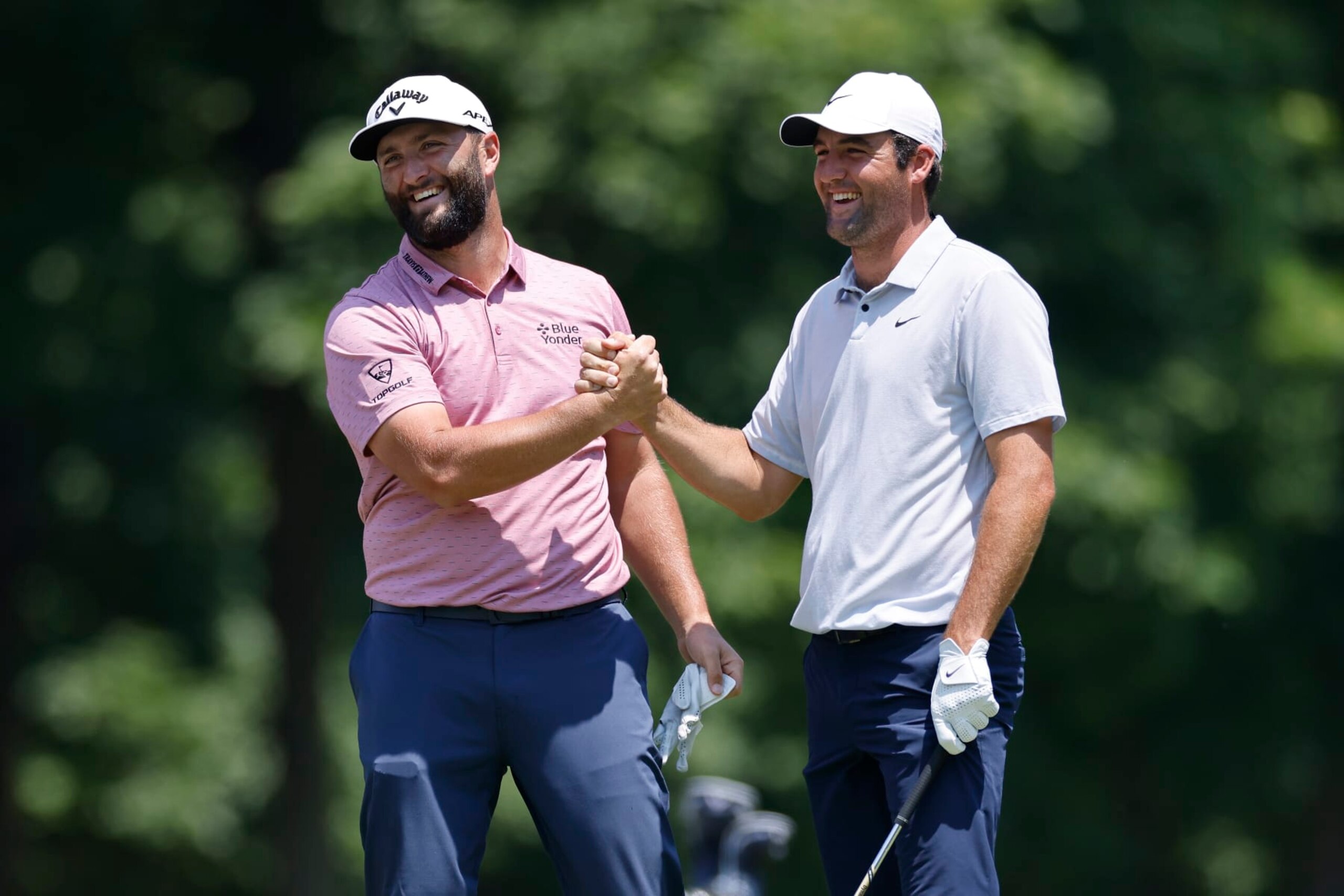 DUBLIN, OH - JUNE 04: Jon Rahm of Spain is congratulated by Scottie Scheffler of the United States after holing his approach shot from the fairway at the 9th hole for eagle during the final round of the Memorial Tournament presented by Workday at Muirfield Village Golf Club on June 04, 2023 in Dublin, Ohio. (Photo by Joe Robbins/Icon Sportswire via Getty Images)