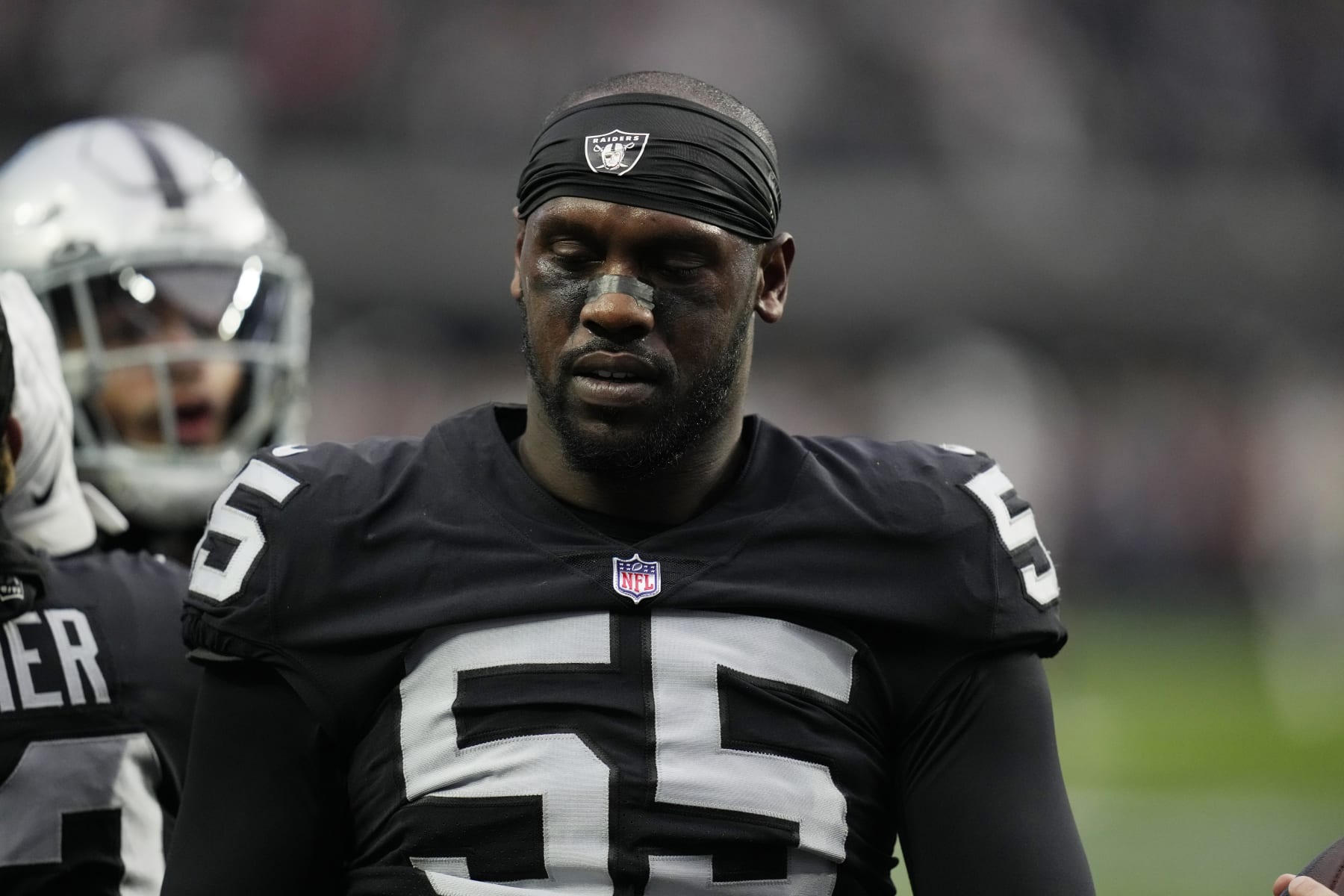 Las Vegas Raiders defensive end Chandler Jones (55) warms up before an NFL football game against the New England Patriots, Monday, Dec. 19, 2022, in Las Vegas. (AP Photo/John Locher)