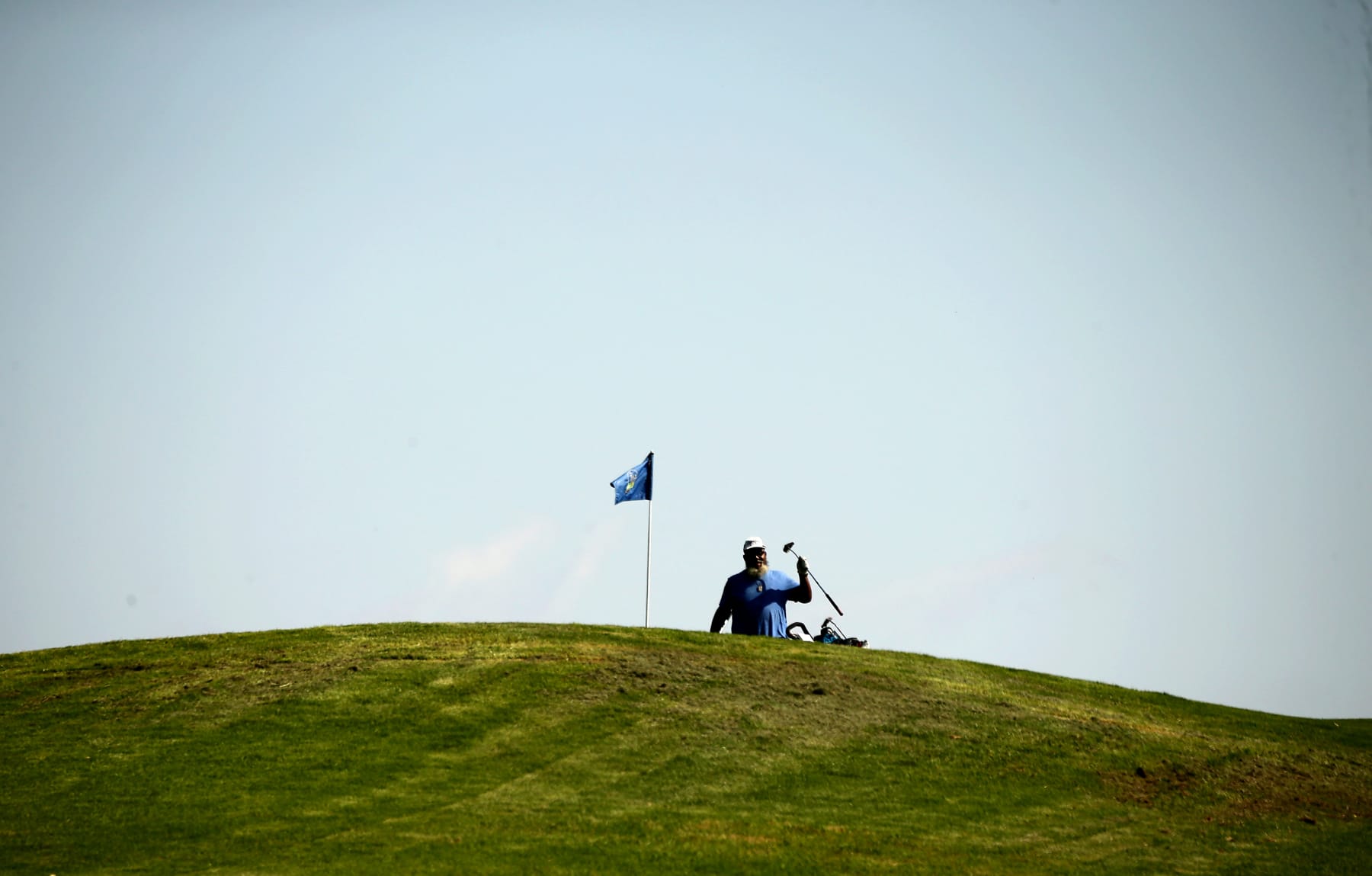 Los angeles, Calif. - June 2, 2023. As part of hosting the US Open, Los Angeles Country Club is donating more than $1 million to redesign and renovate the nine-hole, par-3 Maggie Hathaway Golf Course in South Los Angeles. The goal is to enhance civic pride and promote golf among the underserved. Above, a golfrer plays a hole at Hathaway. (Luis Sinco / Los Angeles Times via Getty Images)