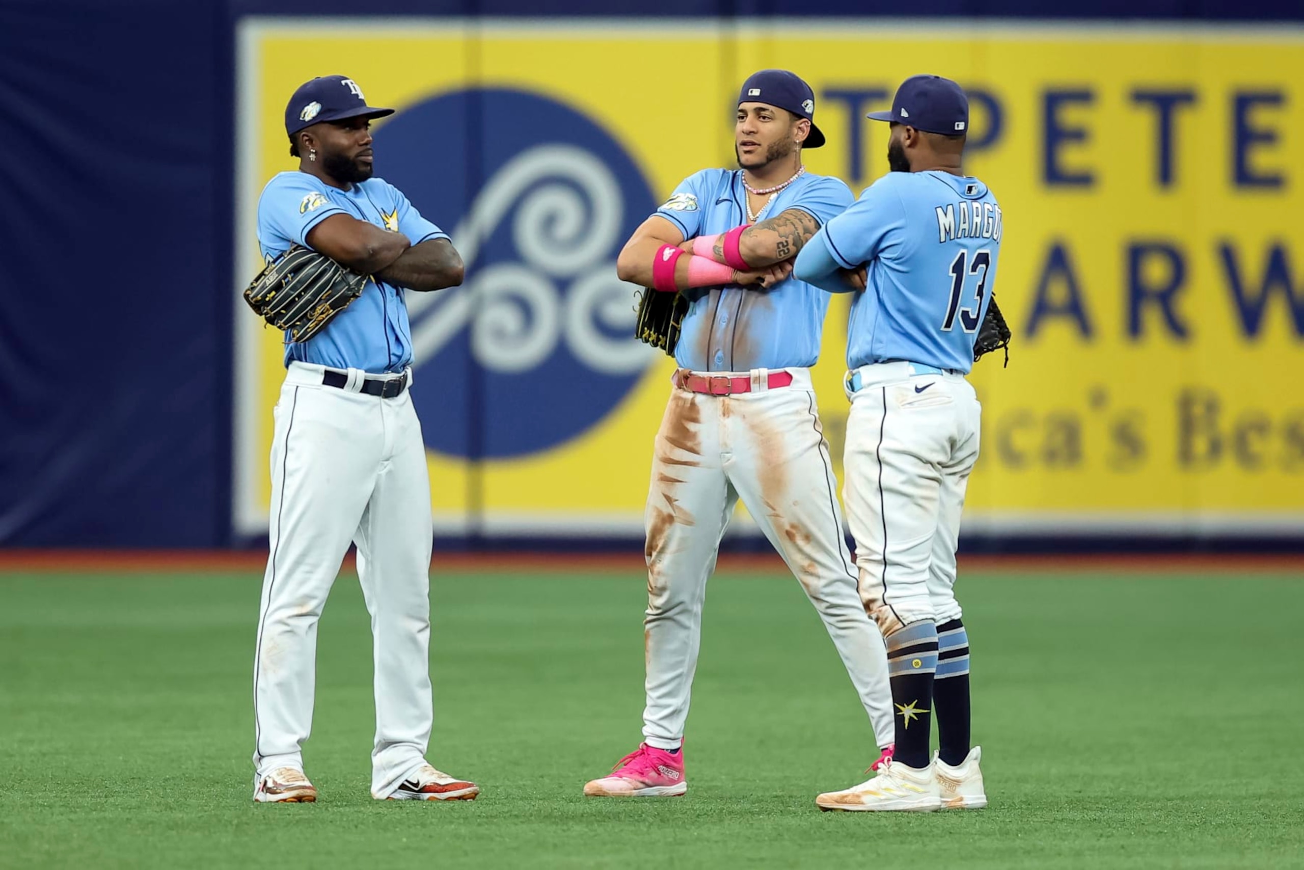 Tampa Bay Rays' Randy Arozarena, left, celebrates with Jose Siri and Manuel Margot after a win over the Texas Rangers in a baseball game Sunday, June 11, 2023, in St. Petersburg, Fla. (AP Photo/Mike Carlson)