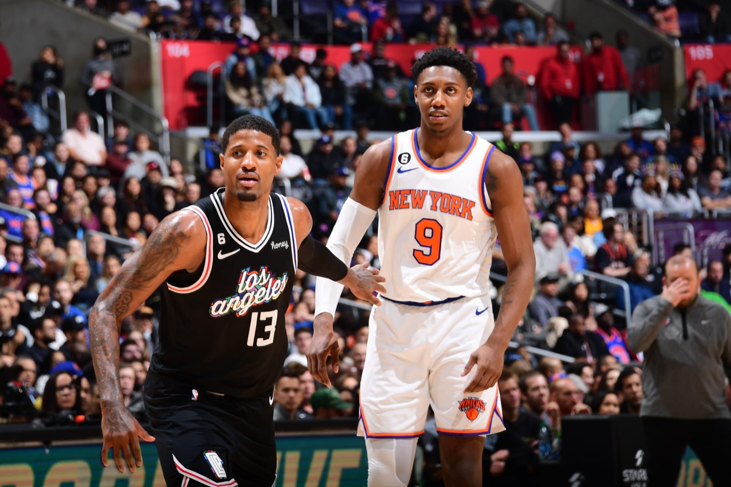 LOS ANGELES, CA - MARCH 11:Paul George #13 of the LA Clippers and RJ Barrett #9 of the New York Knicks box-out during the game on March 11, 2023 at Crypto.Com Arena in Los Angeles, California. NOTE TO USER: User expressly acknowledges and agrees that, by downloading and/or using this Photograph, user is consenting to the terms and conditions of the Getty Images License Agreement. Mandatory Copyright Notice: Copyright 2023 NBAE (Photo by Adam Pantozzi/NBAE via Getty Images)