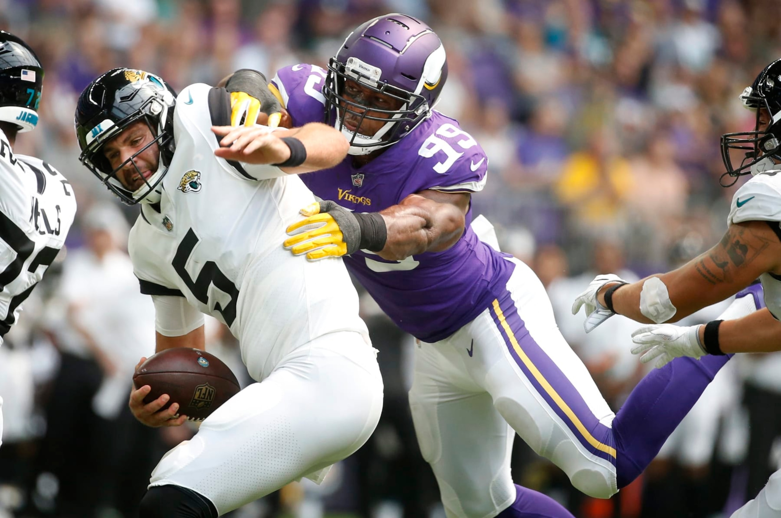 Jacksonville Jaguars quarterback Blake Bortles (5) is sacked by Minnesota Vikings defensive end Danielle Hunter (99) during the first half of an NFL preseason football game, Saturday, Aug. 18, 2018, in Minneapolis. (AP Photo/Bruce Kluckhohn)