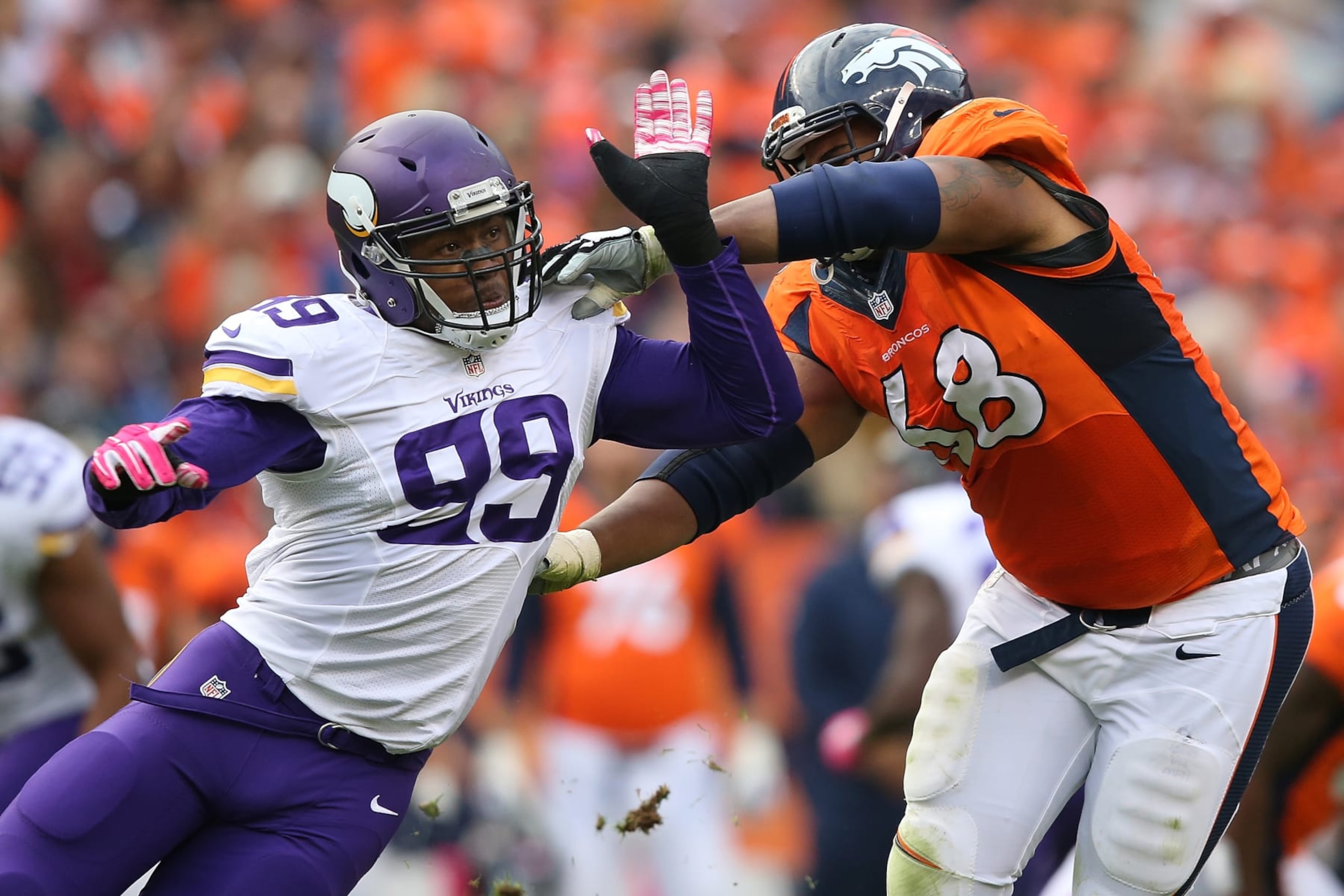 DENVER, CO - OCTOBER 04:  Defensive end Danielle Hunter #99 of the Minnesota Vikings battles against the block of tackle Ryan Harris #68 of the Denver Broncos at Sports Authority Field at Mile High on October 4, 2015 in Denver, Colorado. The Broncos defeated the Vikings 23-20.  (Photo by Doug Pensinger/Getty Images)