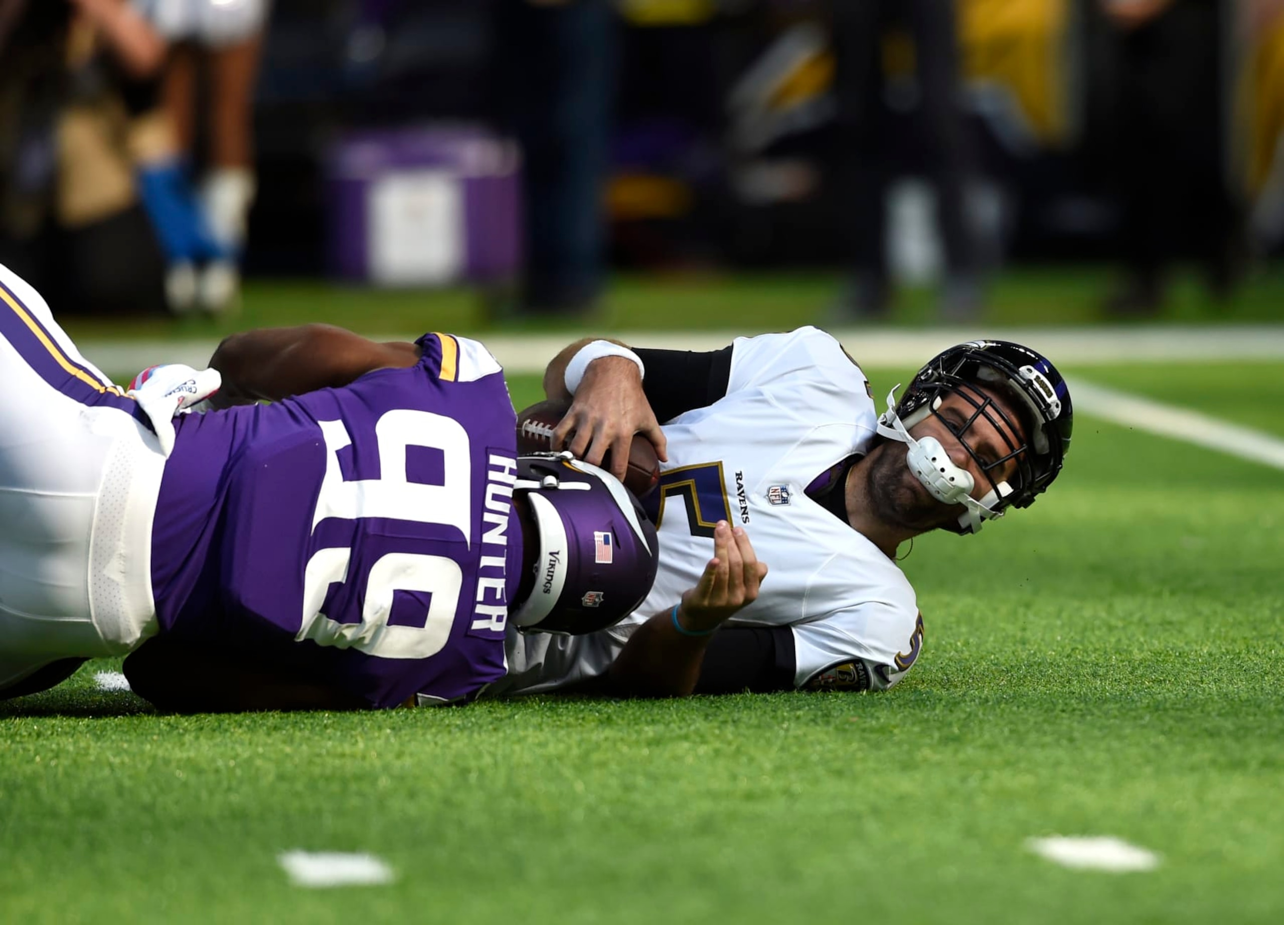 MINNEAPOLIS, MN - OCTOBER 22: Danielle Hunter #99 of the Minnesota Vikings sacks quarterback Joe Flacco #5 of the Baltimore Ravens in the first quarter of the game on October 22, 2017 at U.S. Bank Stadium in Minneapolis, Minnesota. (Photo by Hannah Foslien/Getty Images)